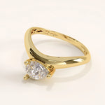 Gold ring with a diamond on a white background