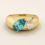 14k gold dome band ring with pear-shaped topaz and oval moissanite. A chunky Toi et Moi gemstone statement ring.