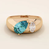 14k gold dome band ring with pear-shaped topaz and oval moissanite. A chunky Toi et Moi gemstone statement ring.
