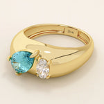 14k gold dome band ring with pear-shaped topaz and oval moissanite. A chunky Toi et Moi gemstone statement ring.