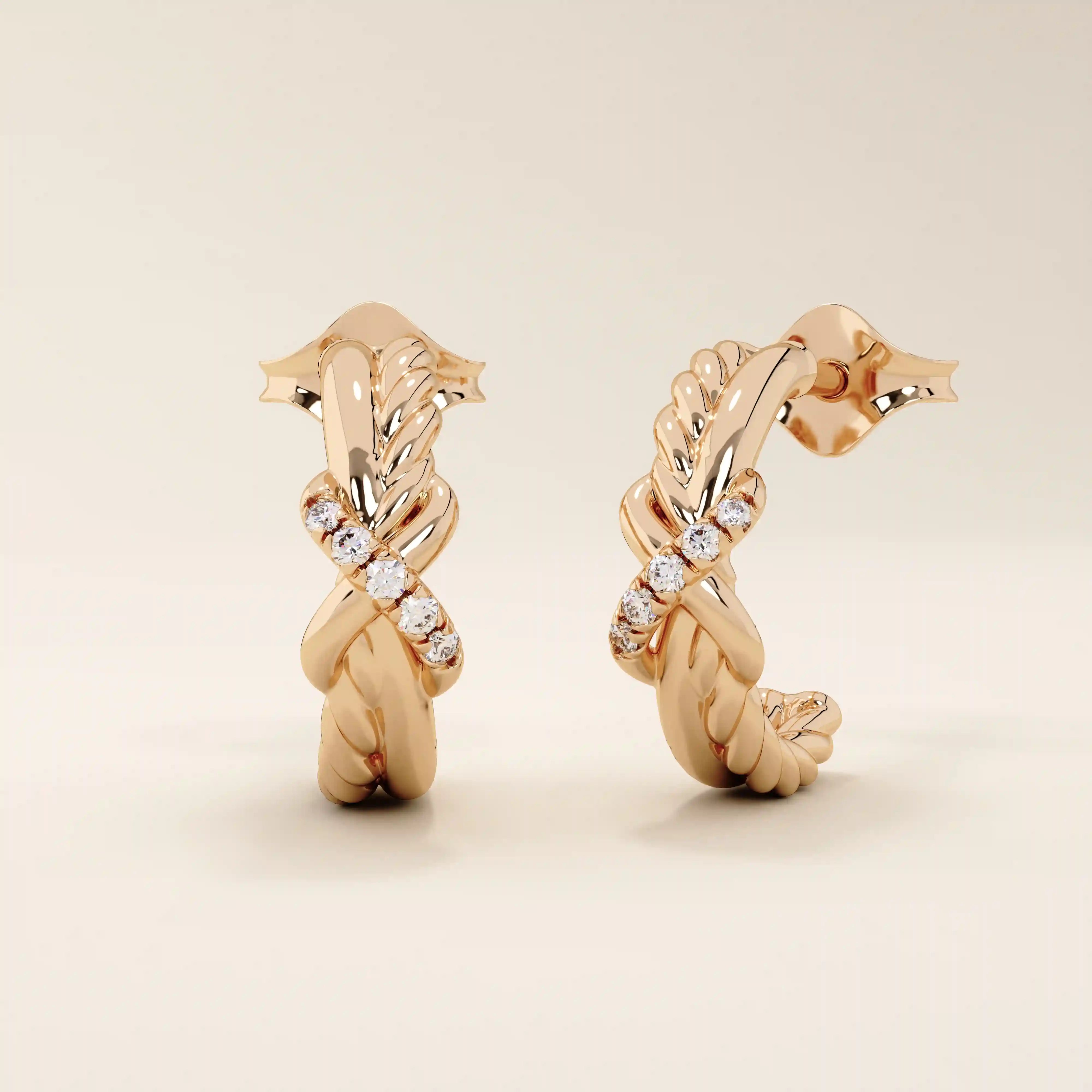 14k rose gold knot stud earrings showcasing twisted rope and polished strands interlaced with a line of round moissanites.