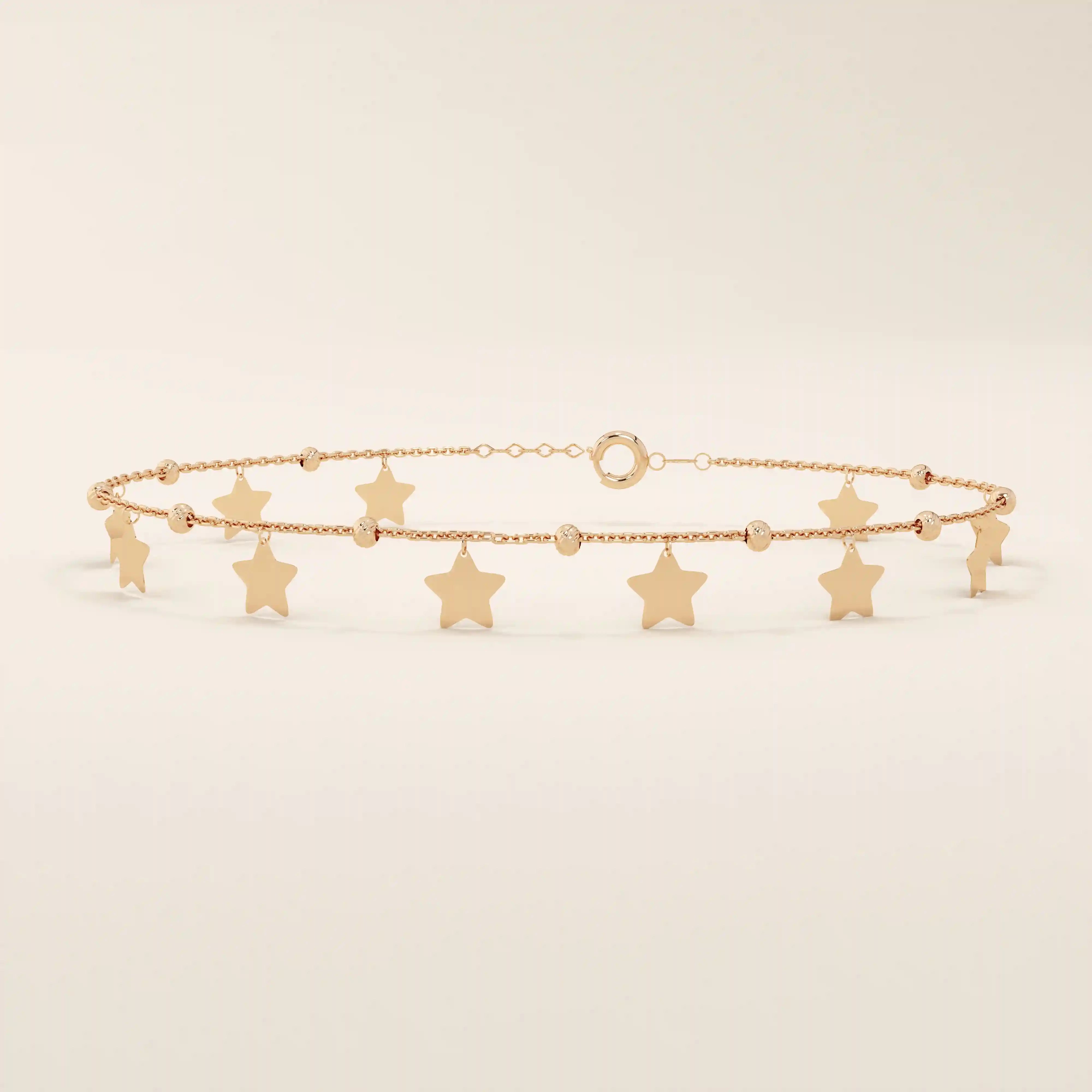 14k rose gold star bracelet with hanging star charms and small beaded accents for a playful, feminine style.