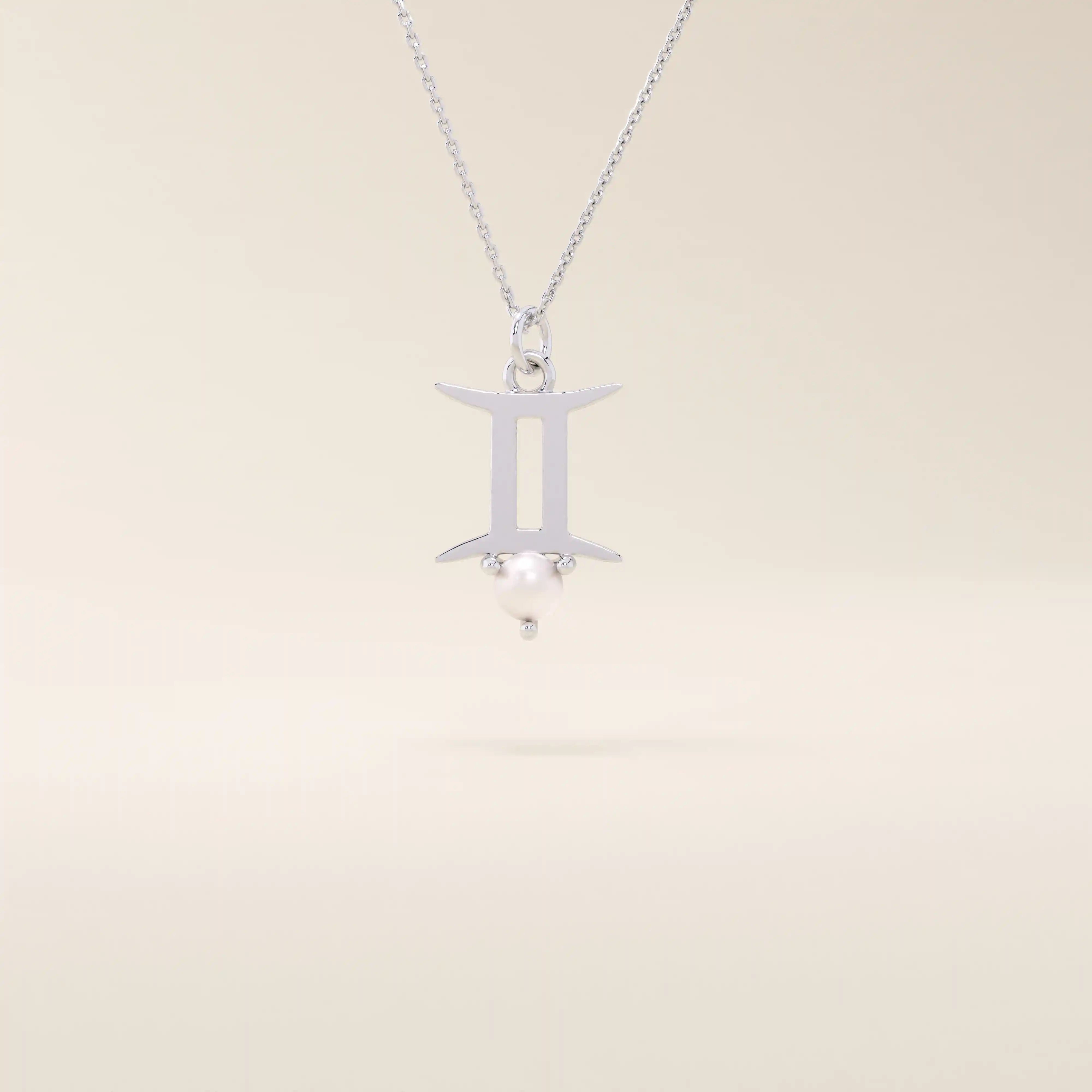 14k solid gold Gemini zodiac symbol pendant necklace with a natural pearl charm, minimalist celestial design.