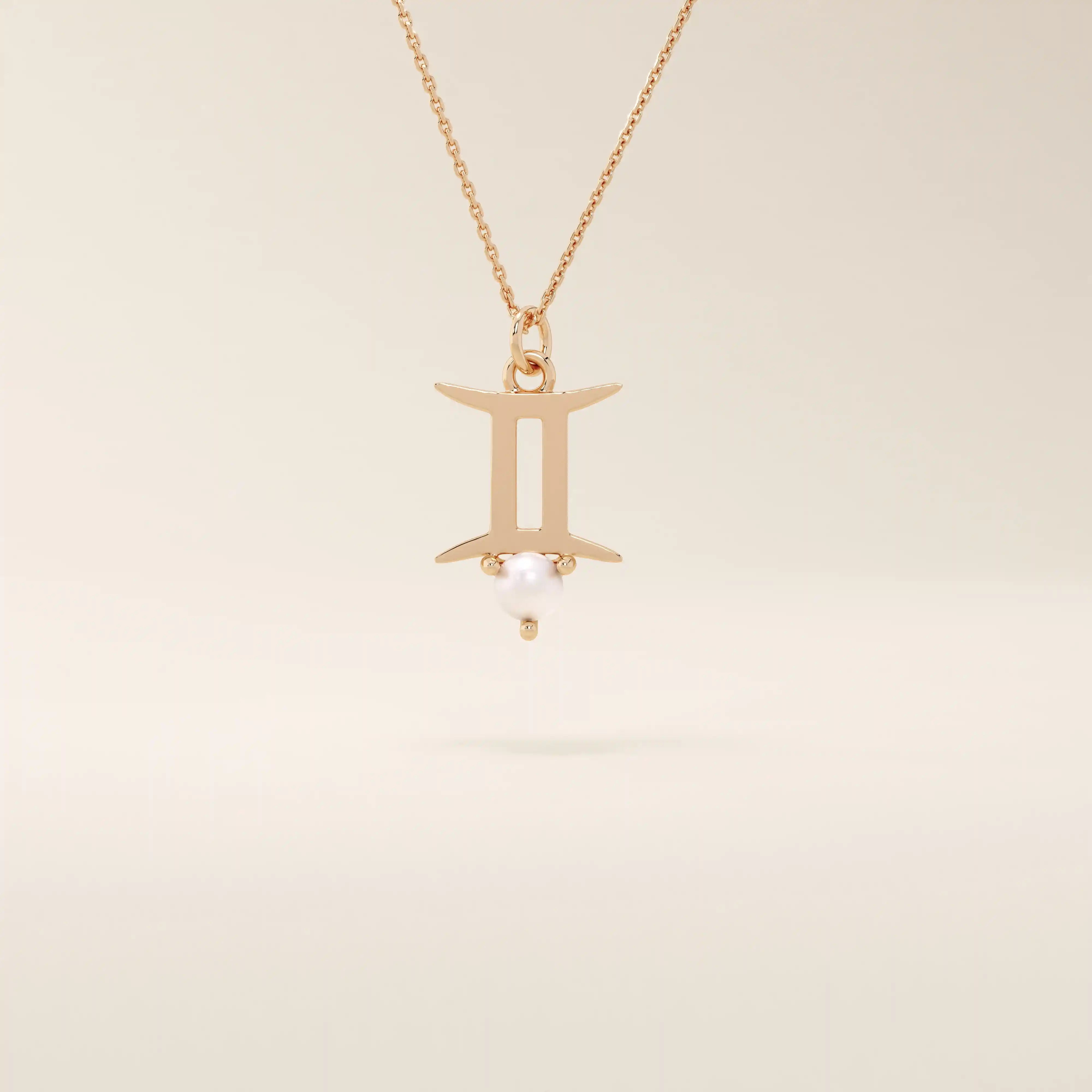 14k solid gold Gemini zodiac symbol pendant necklace with a natural pearl charm, minimalist celestial design.