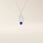 14k solid gold Virgo zodiac symbol pendant necklace with a round blue sapphire, minimalist astrology birthstone jewelry.