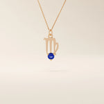 14k solid gold Virgo zodiac symbol pendant necklace with a round blue sapphire, minimalist astrology birthstone jewelry.