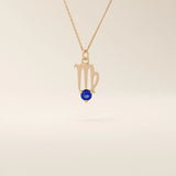 14k solid gold Virgo zodiac symbol pendant necklace with a round blue sapphire, minimalist astrology birthstone jewelry.