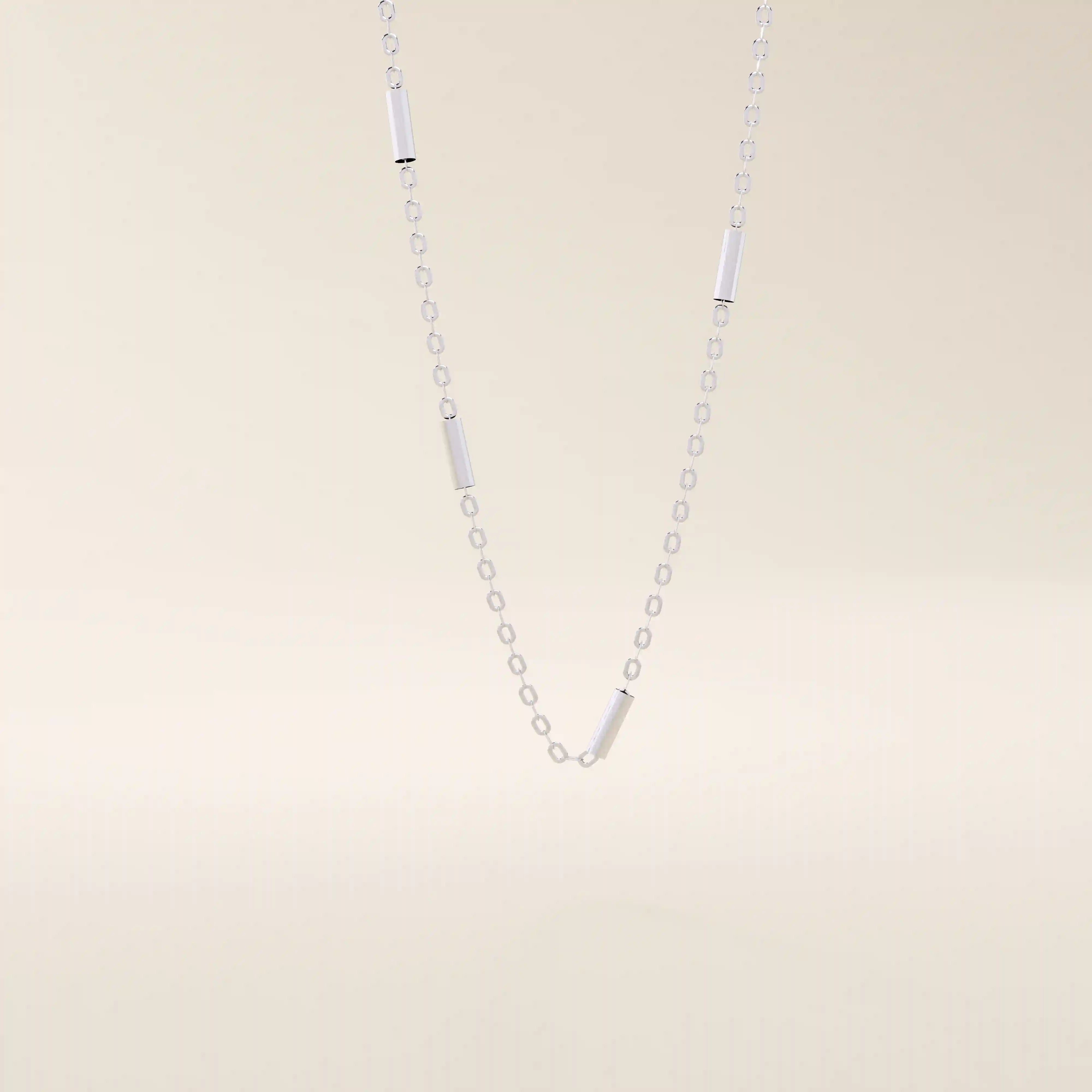 14k solid gold bar chain necklace with sleek horizontal links and a polished finish. A modern and minimal gold chain. Great for layering or wearing alone.