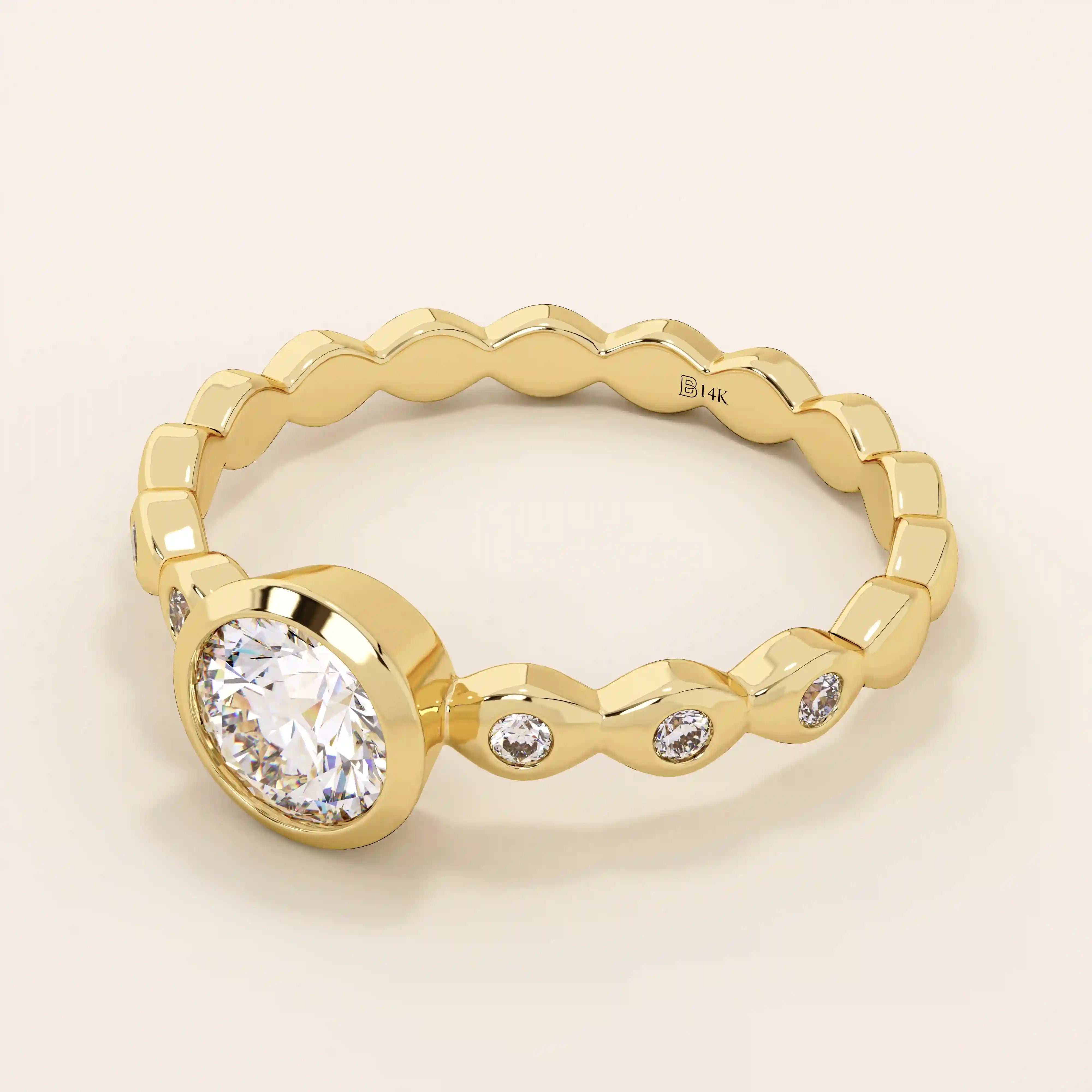14k solid gold bezel-set solitaire engagement ring featuring a round moissanite and subtle detailing along the band. A modern twist on a classic style. Perfect for timeless proposals.