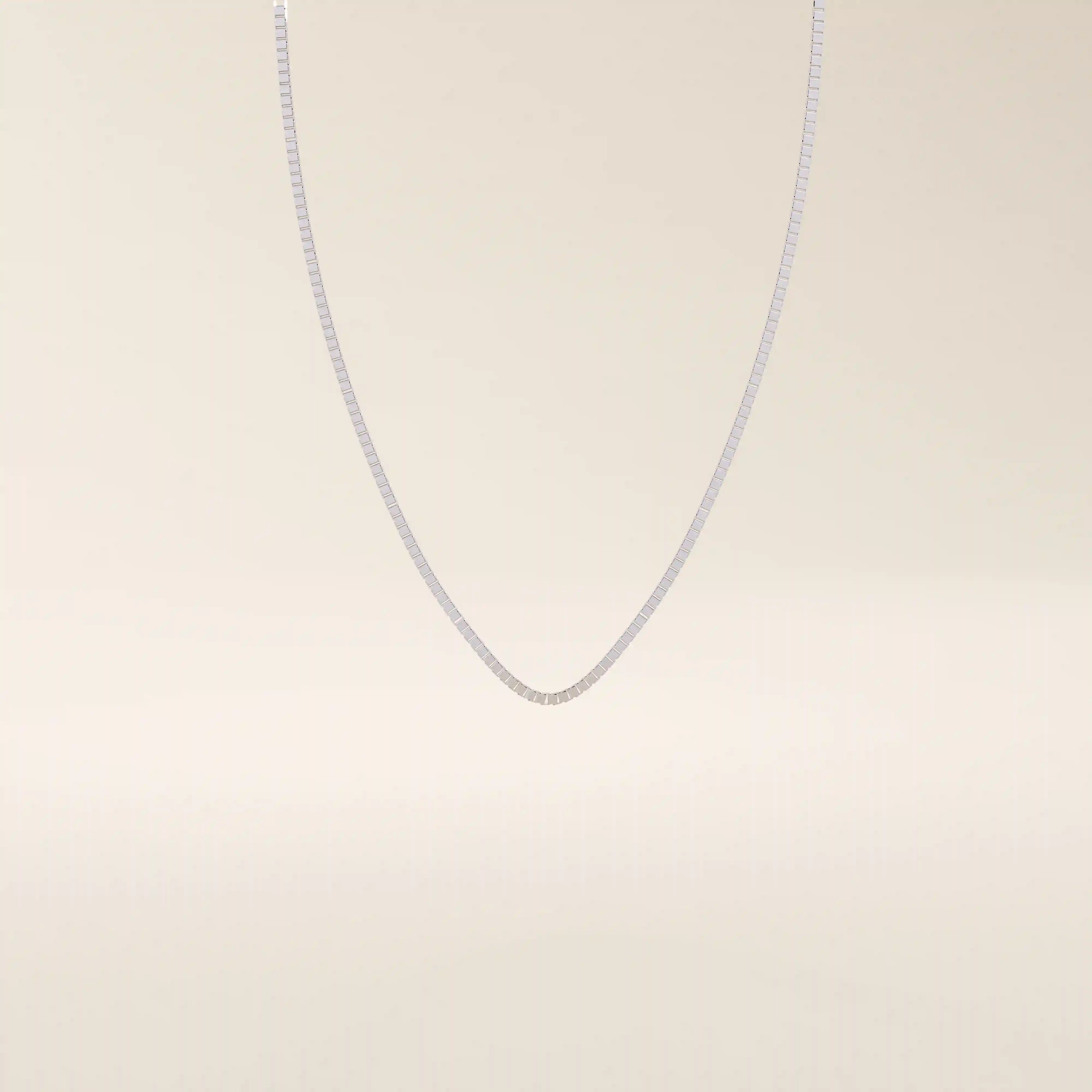 14k solid gold box chain necklace with square-shaped links and a smooth finish. A timeless and durable gold chain. Ideal for daily wear or layering.