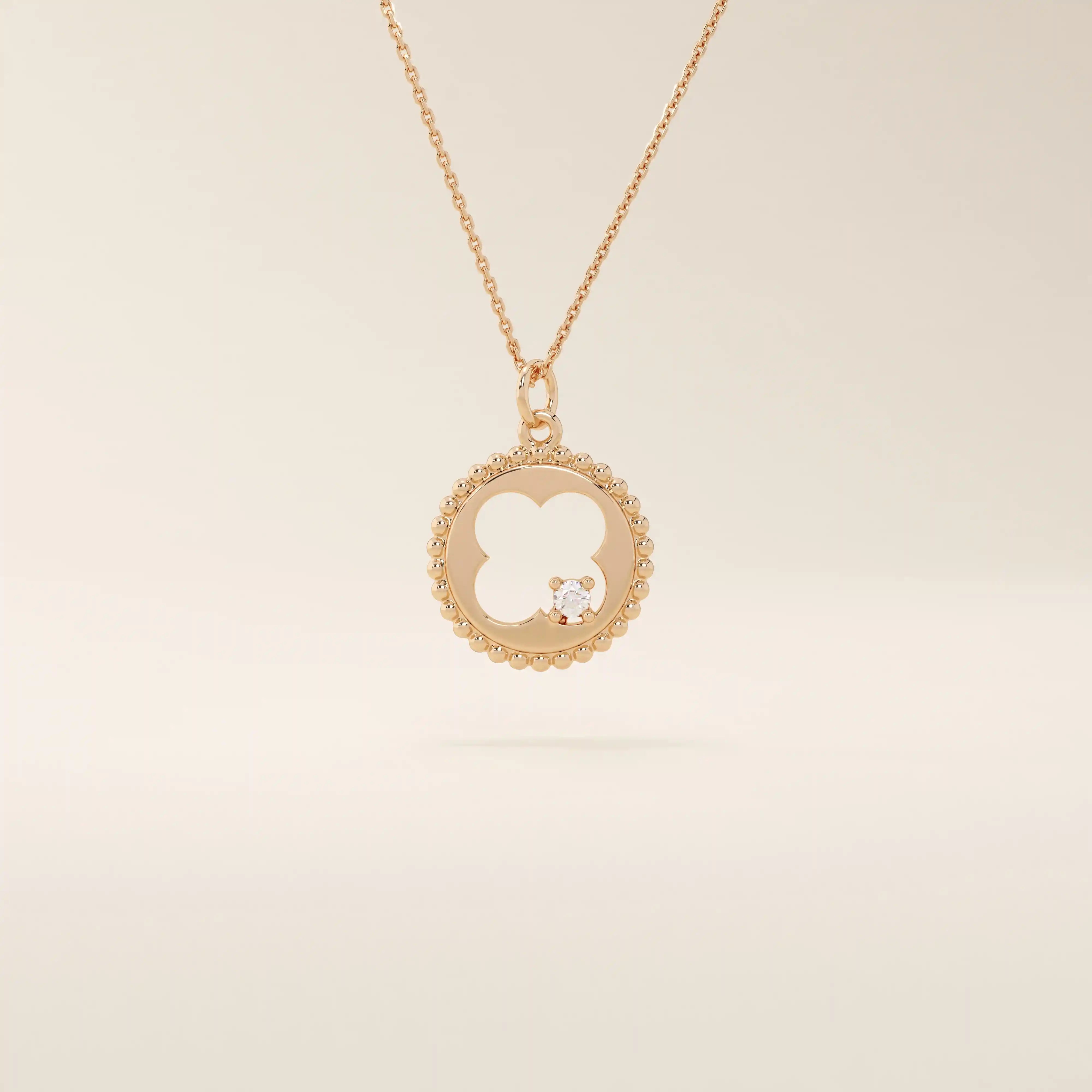 14k solid gold circle pendant necklace featuring a clover-shaped cutout and a single sparkling moissanite. Symbolic and delicate design.