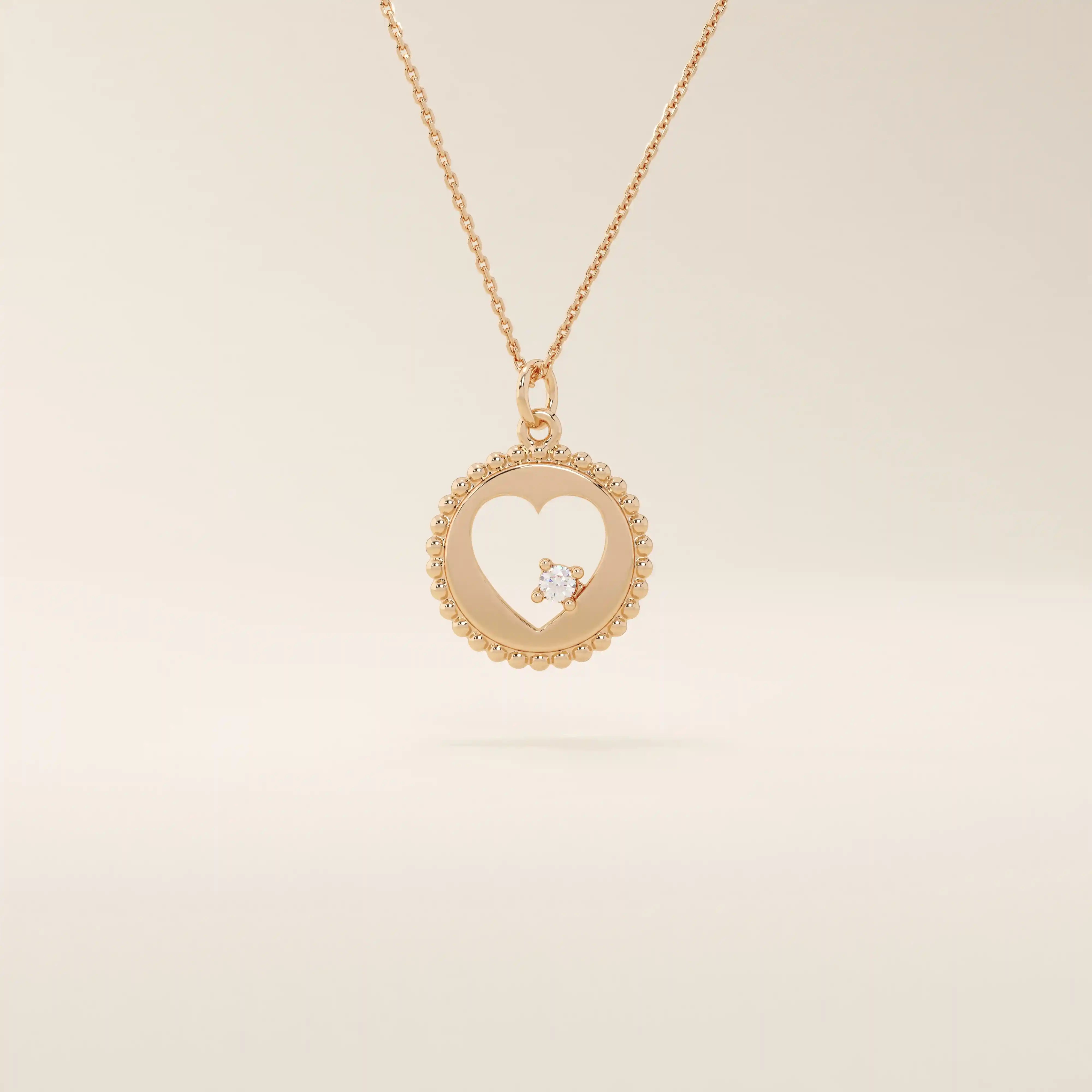 14k solid gold circle pendant necklace featuring a heart-shaped cutout and a single sparkling moissanite. Delicate and meaningful design.