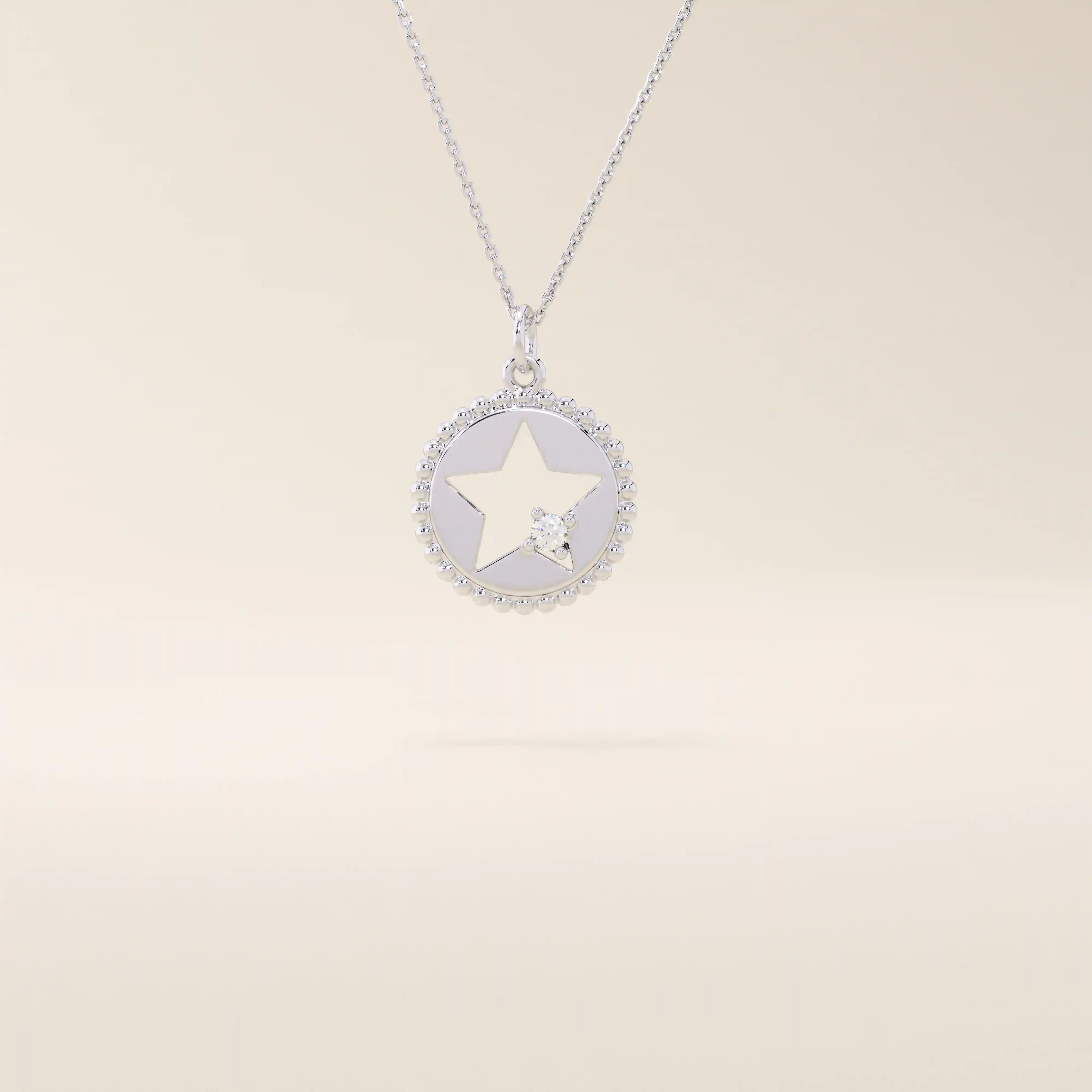 14k solid gold circle pendant necklace featuring a star-shaped cutout and a single sparkling moissanite. Delicate and celestial-inspired design.