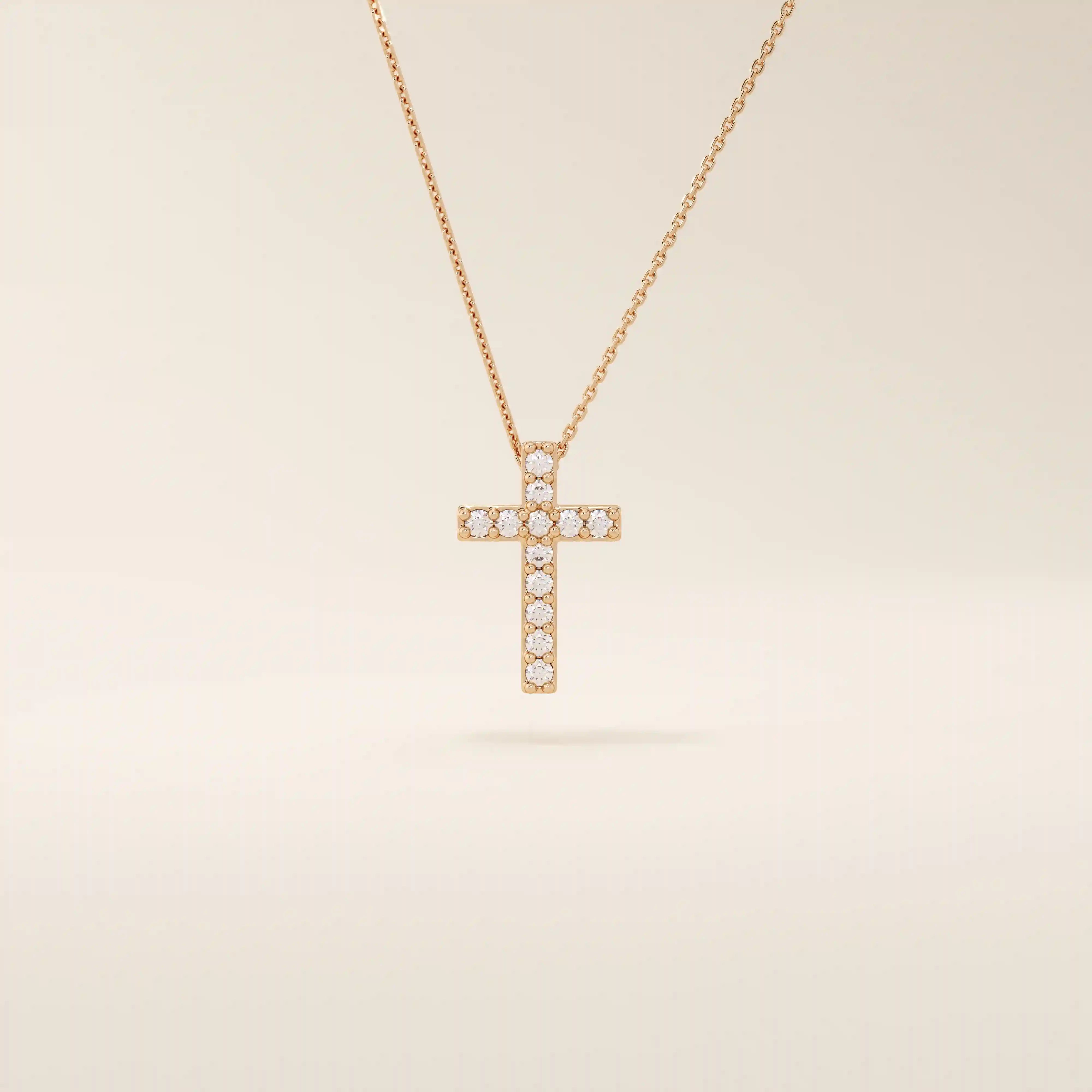 14k solid gold cross necklace with front and back pave moissanite detailing. Reversible and minimalist gold necklace design. Perfect for daily or layered styling.