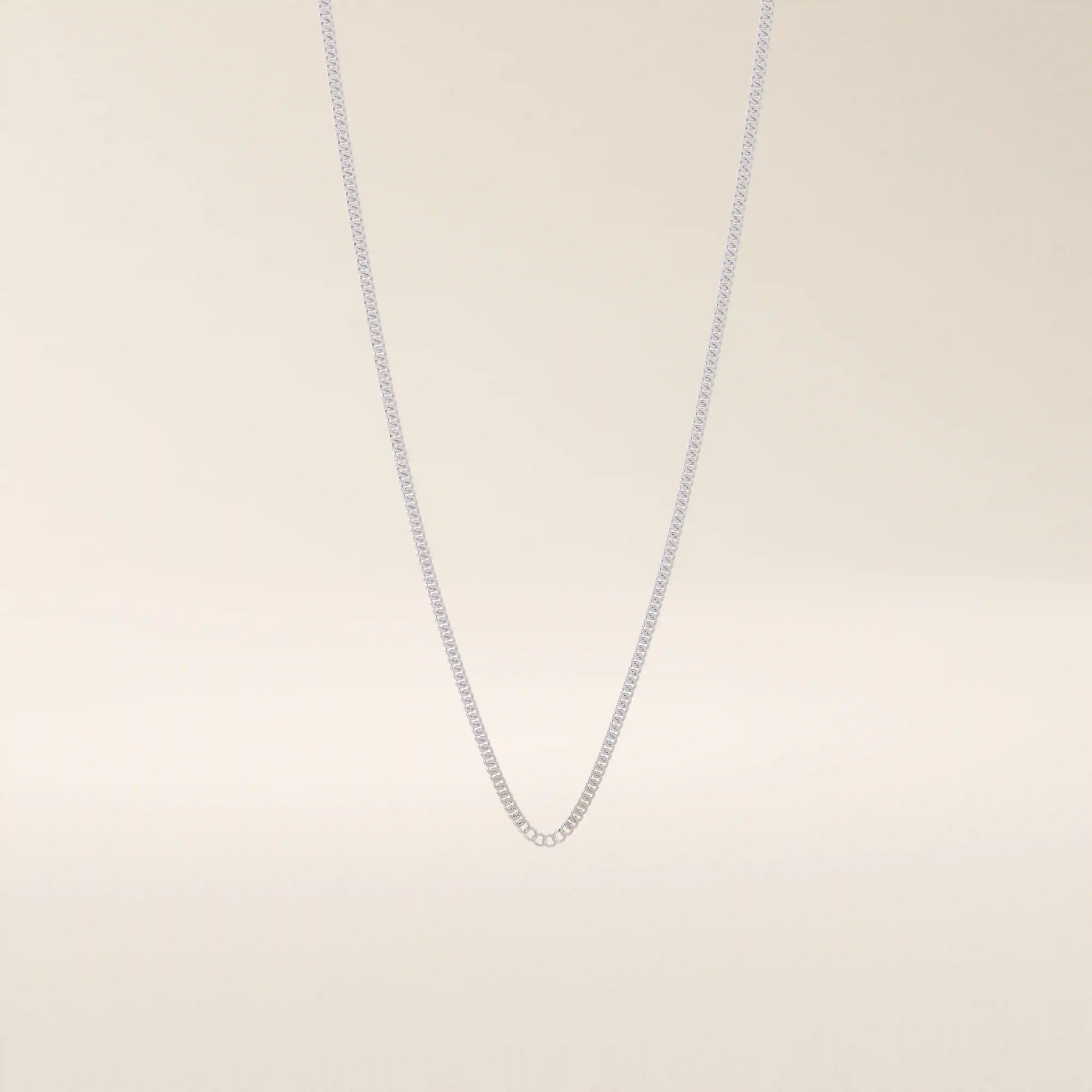 14k solid gold curb chain necklace with flat, closely interlocked links and a polished finish. A timeless and sturdy gold chain. Ideal for everyday wear or layering.