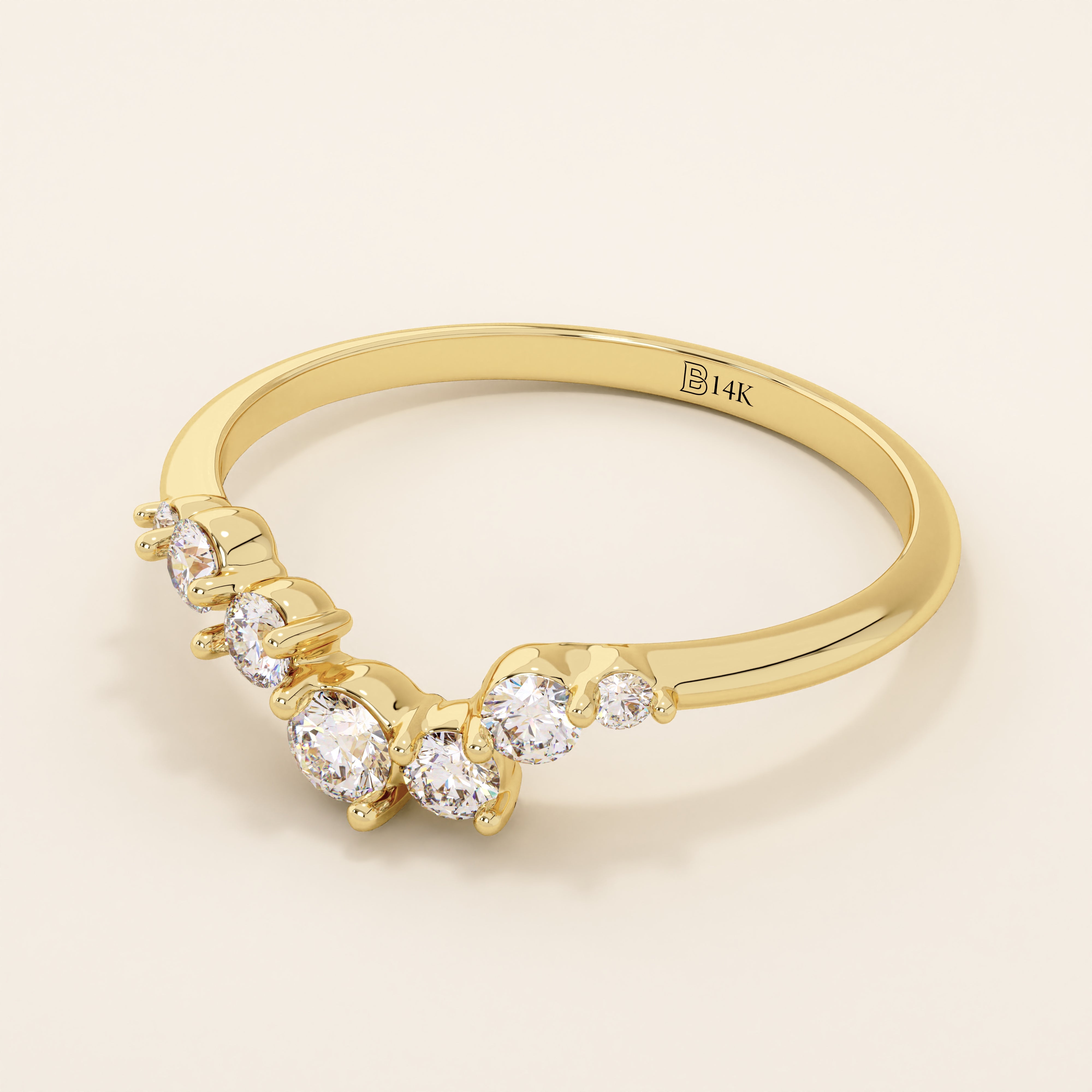 14k solid gold curved nesting ring featuring a cluster of sparkling moissanites. A delicate and elegant stacking ring with organic design.