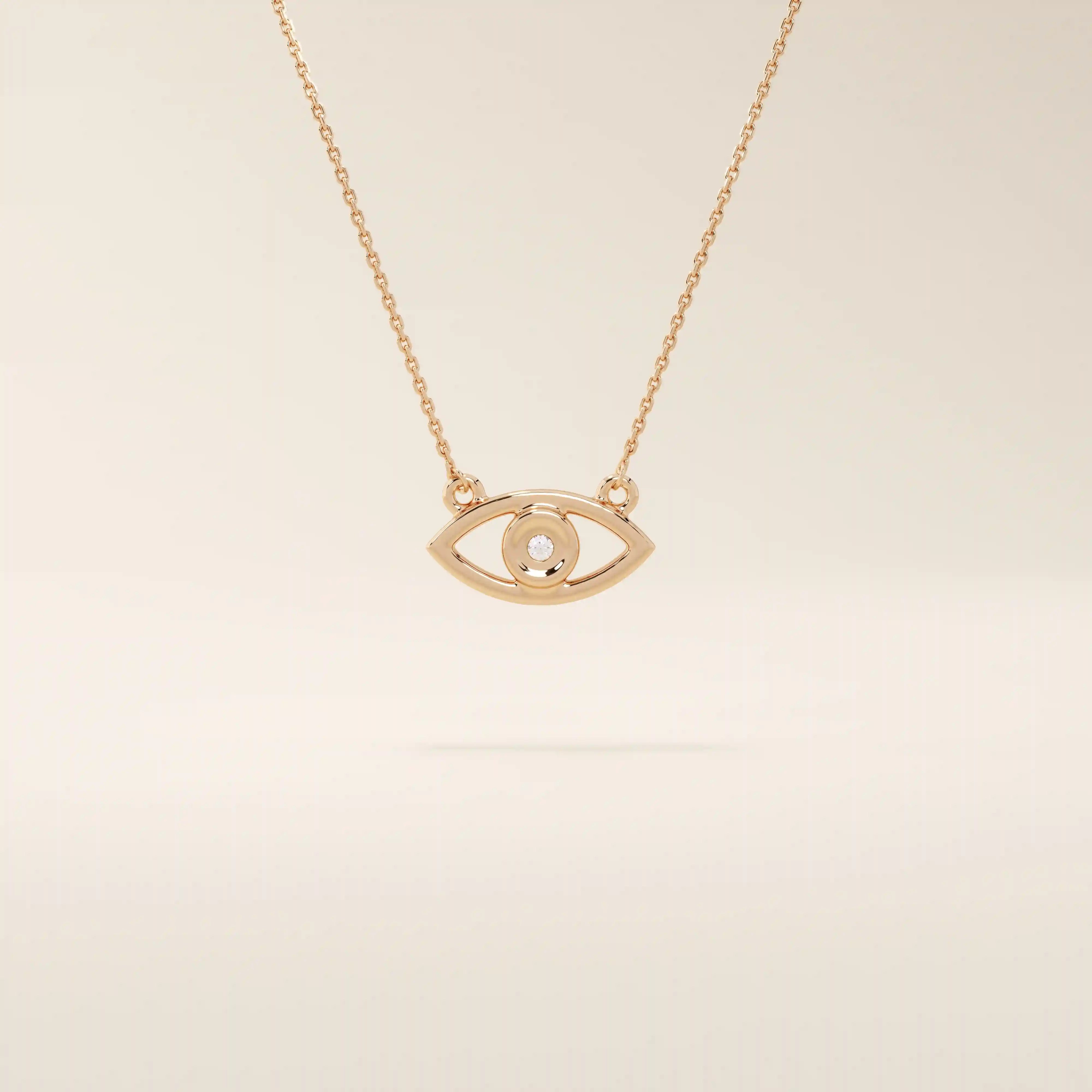 14k solid gold evil eye necklace with a minimalist eye shape and smooth polished finish. A protective and meaningful gold piece. Perfect for everyday wear or gifting.