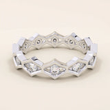 14k solid gold geometric eternity band ring featuring rhombus shapes adorned with sparkling moissanites. Bold and modern design.