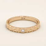 14k solid gold  geometric textured patterned slim unisex wedding band alliance with bezel set princess cut moissanite