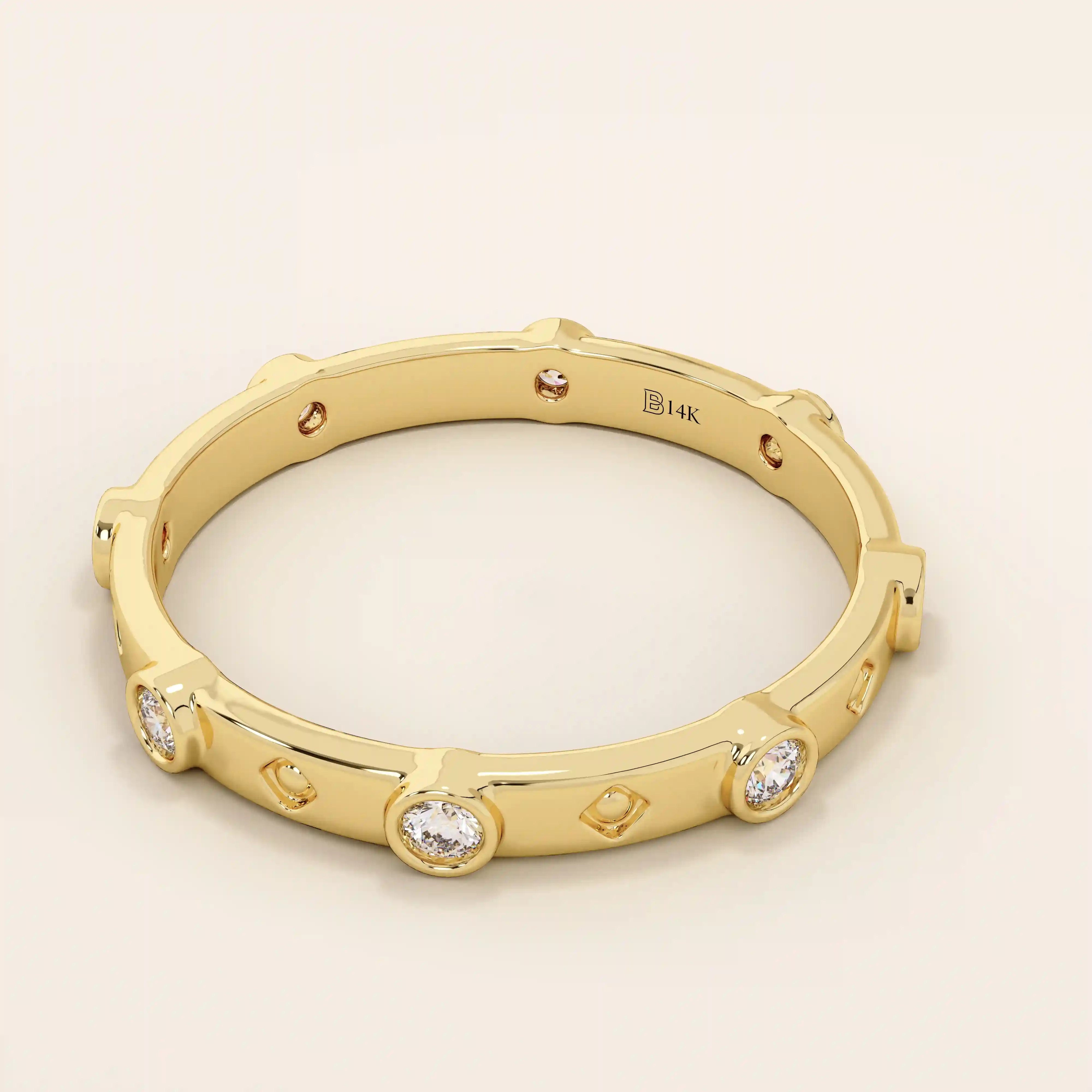 14k solid gold minimalist band ring with bezel-set moissanites around the band. Modern eternity statement jewelry for women.