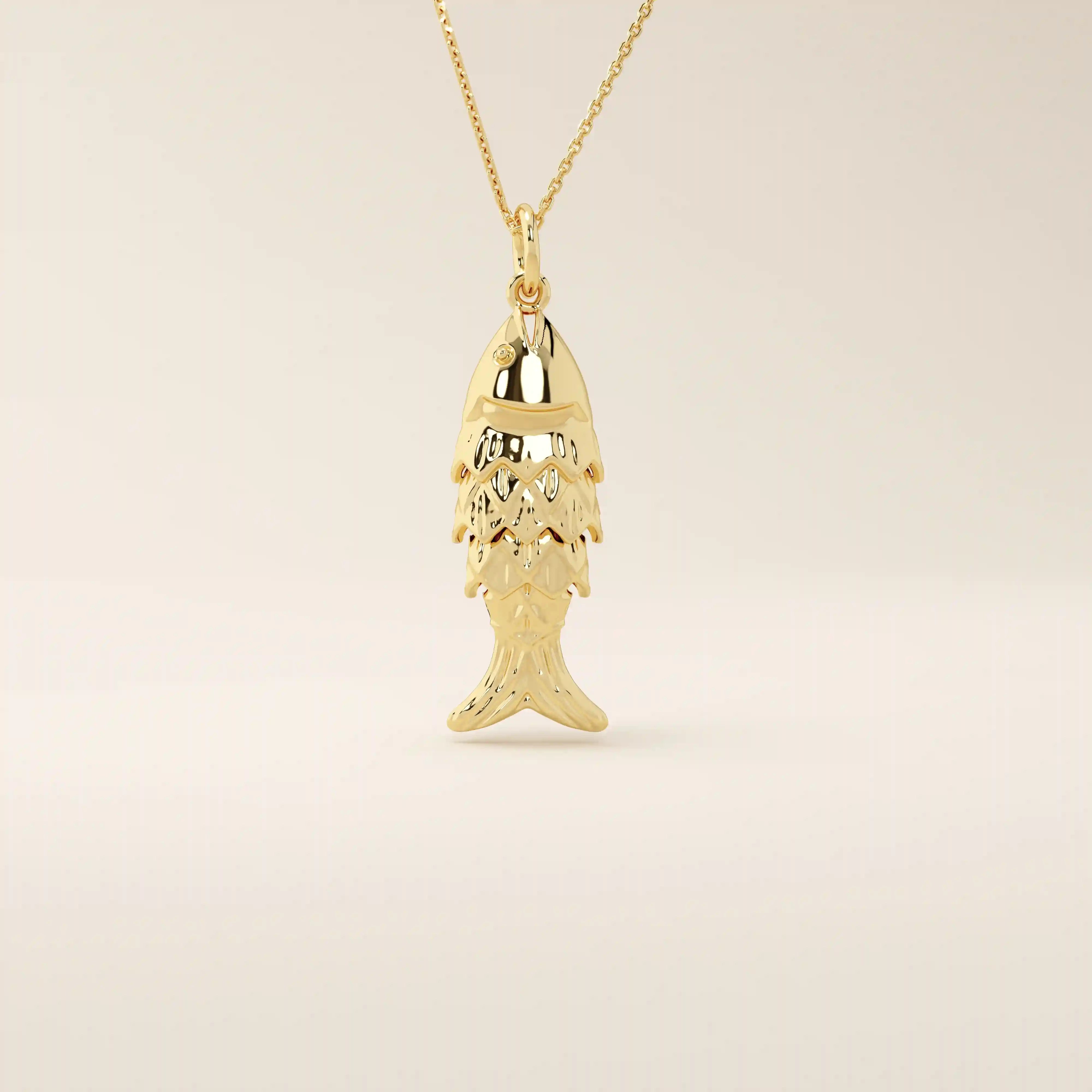 14k solid gold necklace featuring a minimalist fish design. Symbolic and playful gold jewelry. Ideal for everyday wear or gifting.