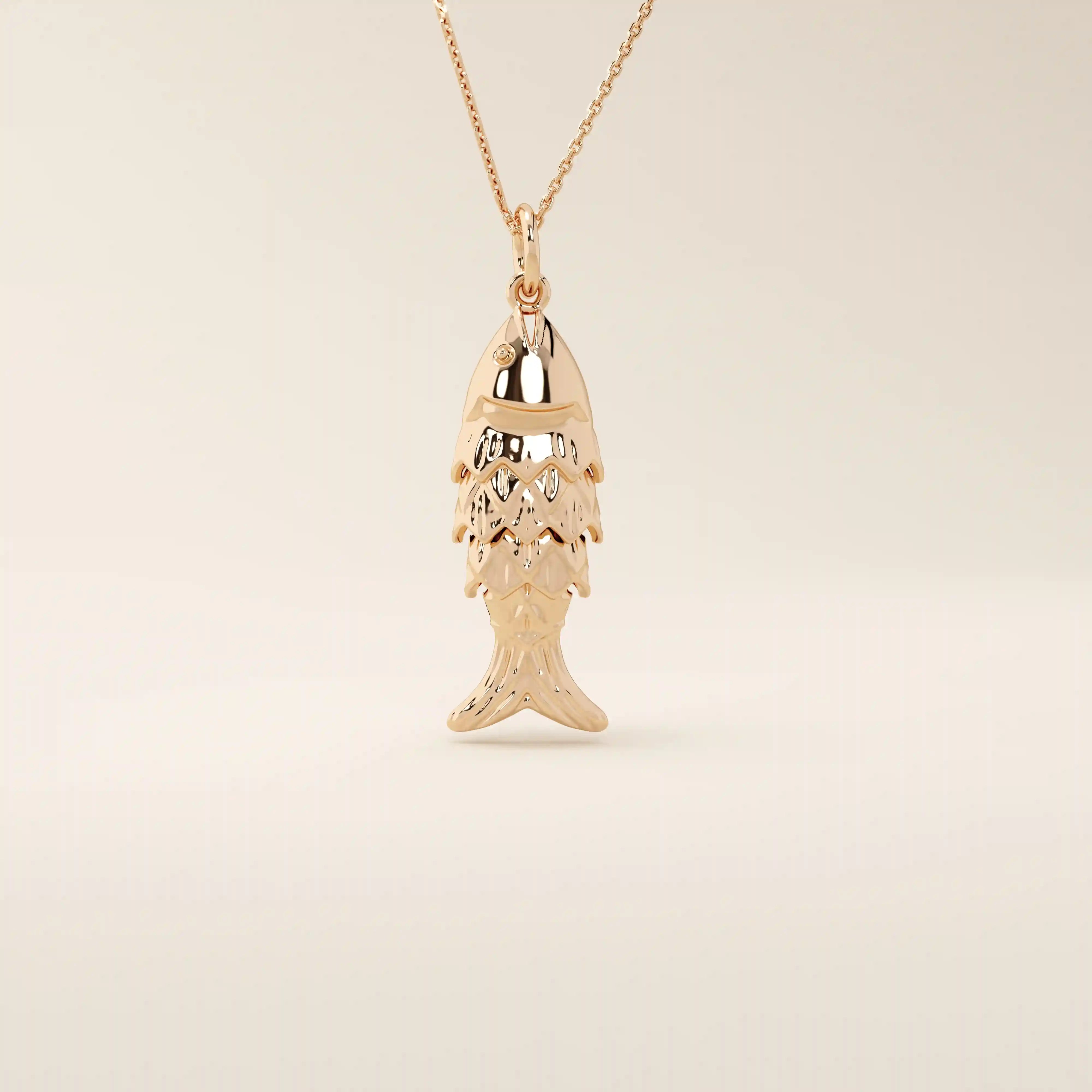 14k solid gold necklace featuring a minimalist fish design. Symbolic and playful gold jewelry. Ideal for everyday wear or gifting.