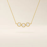 14k solid gold necklace featuring three bezel-set moissanite stones. A minimalist and stackable design perfect for layering everyday jewelry.