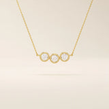 14k solid gold necklace featuring three bezel-set moissanite stones. A minimalist and stackable design perfect for layering everyday jewelry.