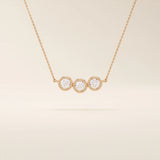 14k solid gold necklace featuring three bezel-set moissanite stones. A minimalist and stackable design perfect for layering everyday jewelry.