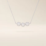 14k solid gold necklace featuring three bezel-set moissanite stones. A minimalist and stackable design perfect for layering everyday jewelry.