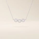 14k solid gold necklace featuring three bezel-set moissanite stones. A minimalist and stackable design perfect for layering everyday jewelry.