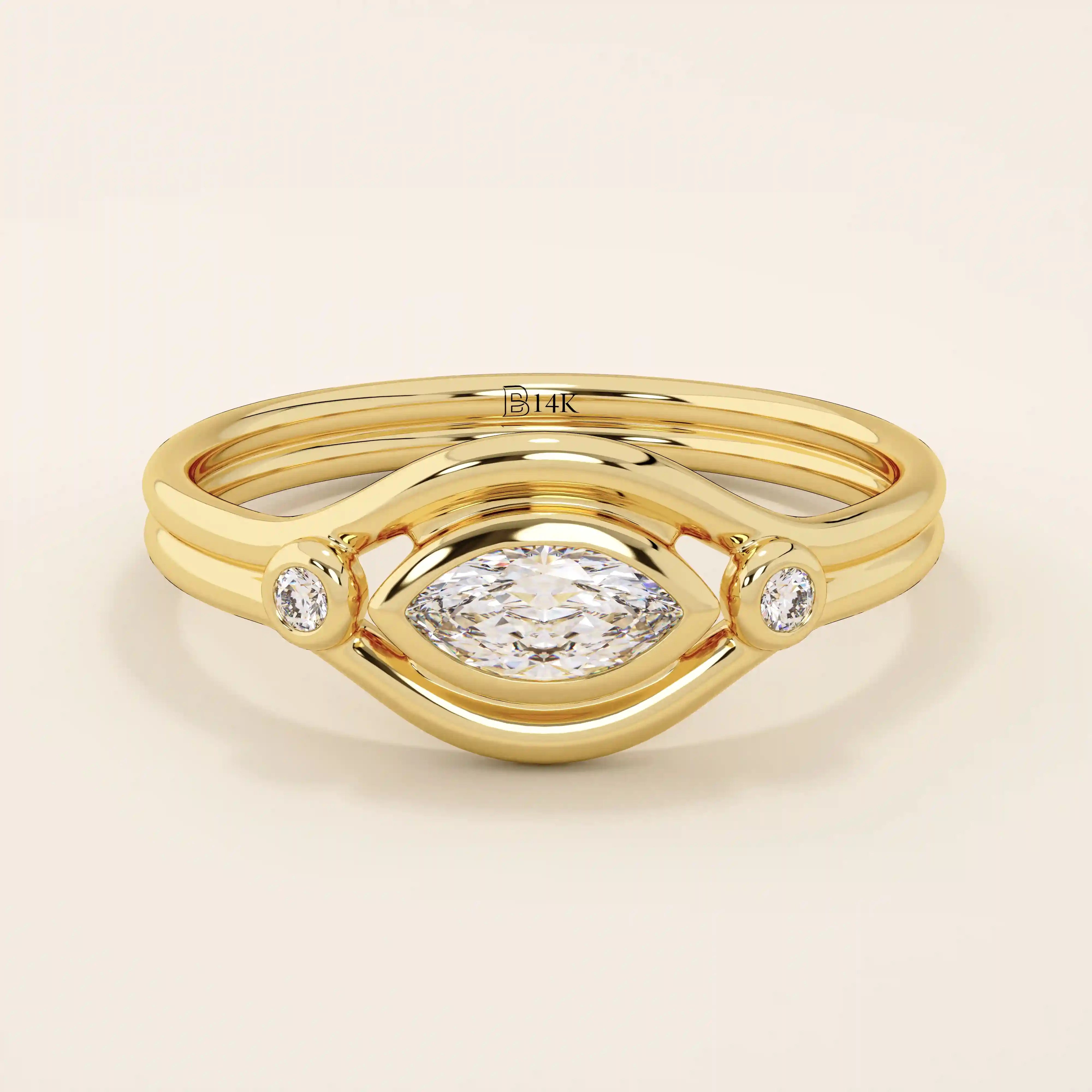 14k solid gold pinky signet ring featuring a bezel-set marquise moissanite in an evil eye design. A protective and stylish symbol in a minimalist ring.