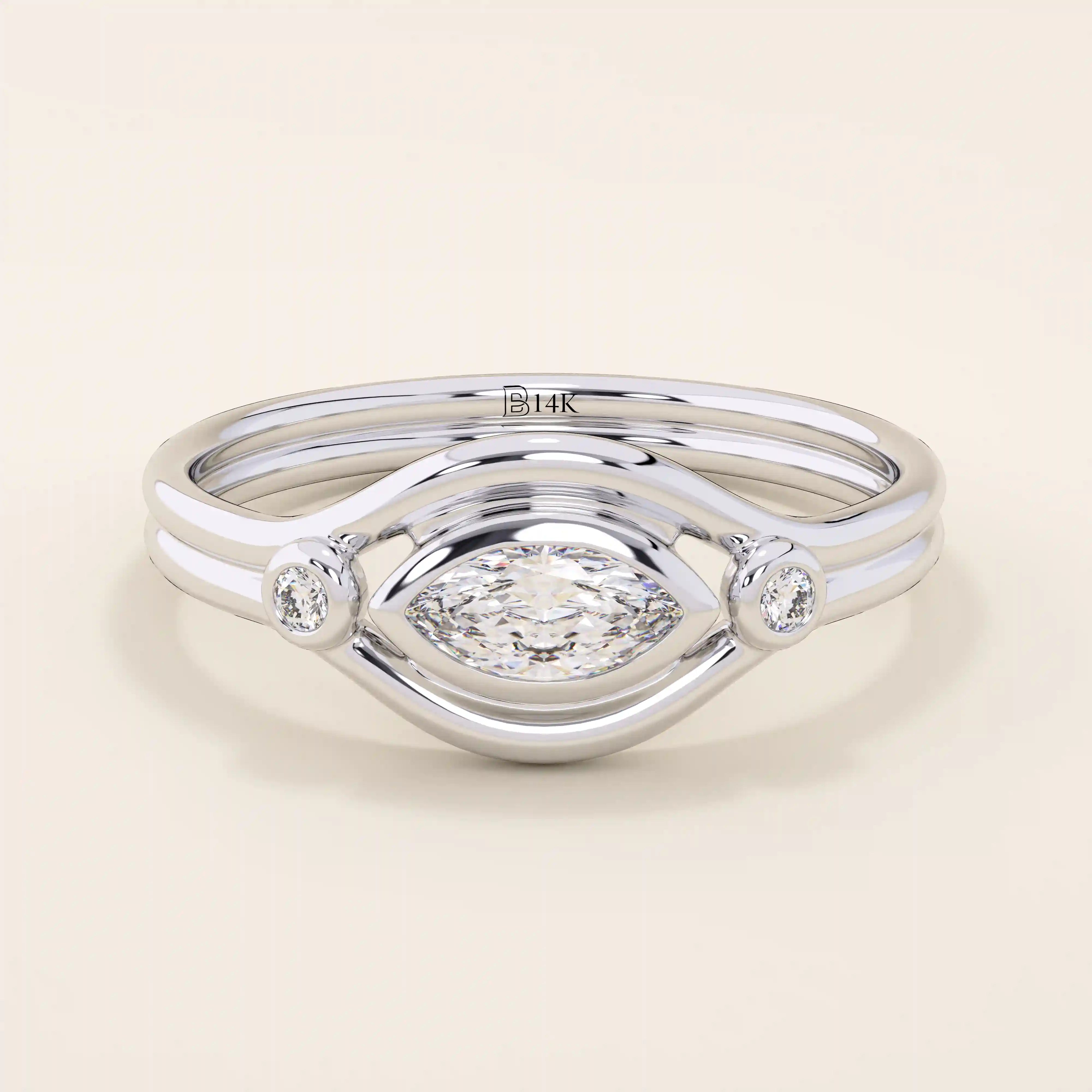 14k solid gold pinky signet ring featuring a bezel-set marquise moissanite in an evil eye design. A protective and stylish symbol in a minimalist ring.