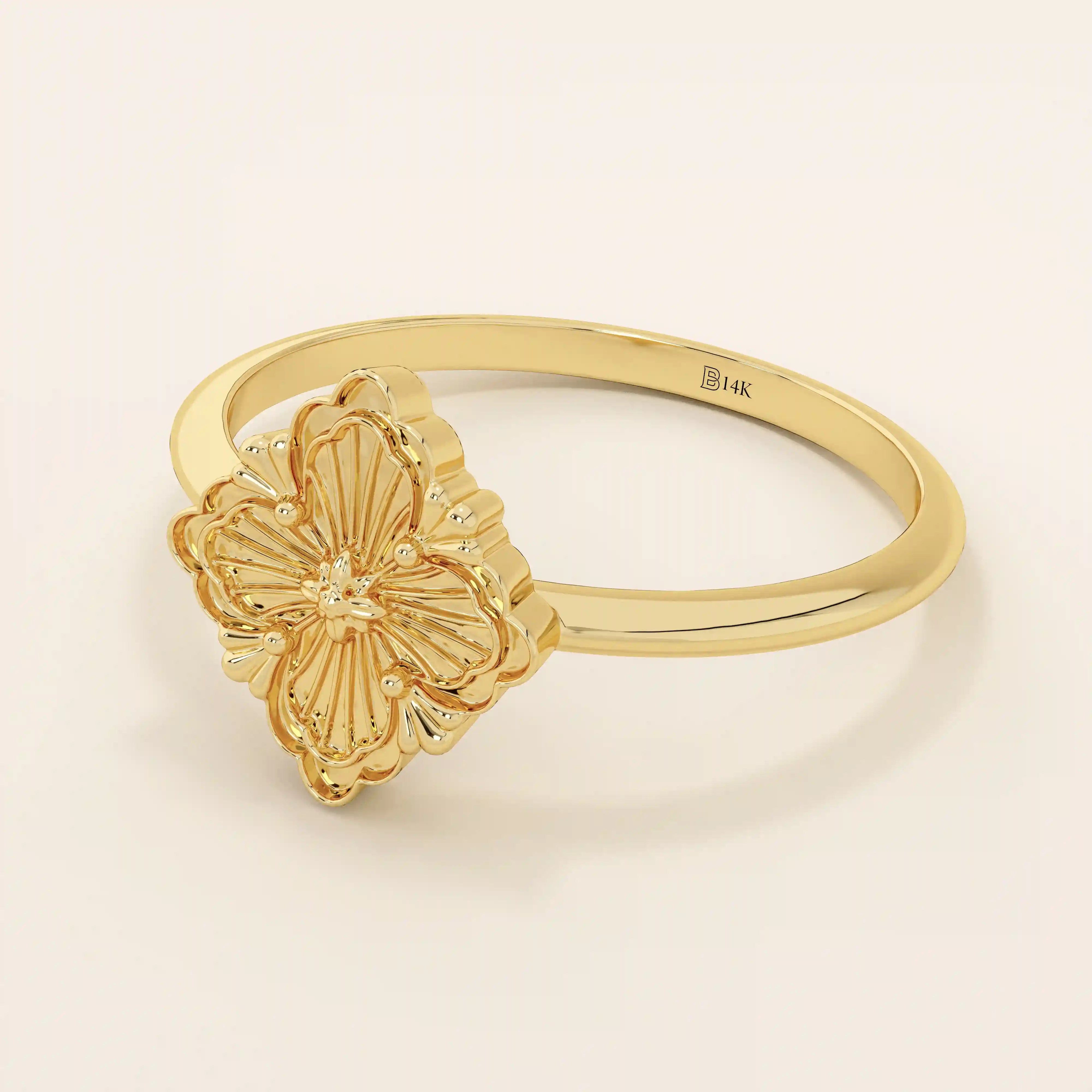14k solid gold pinky signet ring featuring a clover-shaped motif. A minimalist and meaningful design for women’s everyday wear.