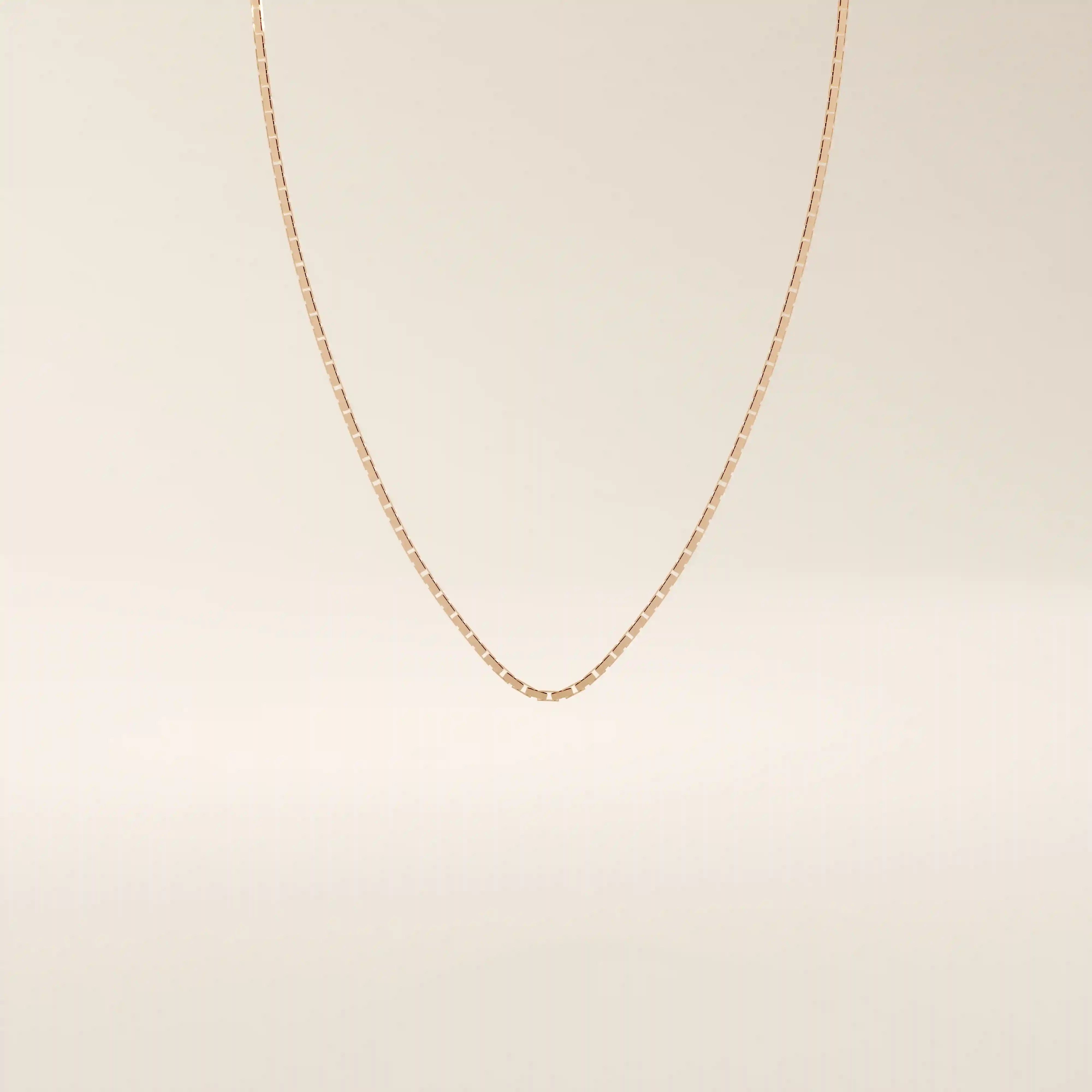 14k solid gold rectangle link chain necklace with clean, structured lines. A bold yet minimal gold chain for everyday style. Perfect for wearing alone or layering.