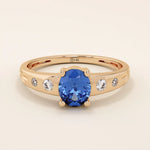 14k solid gold ring featuring an oval cut sapphire gemstone. Timeless and rich in color, perfect for everyday wear or special occasions.