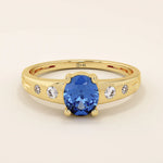 14k solid gold ring featuring an oval cut sapphire gemstone. Timeless and rich in color, perfect for everyday wear or special occasions.