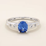 14k solid gold ring featuring an oval cut sapphire gemstone. Timeless and rich in color, perfect for everyday wear or special occasions.