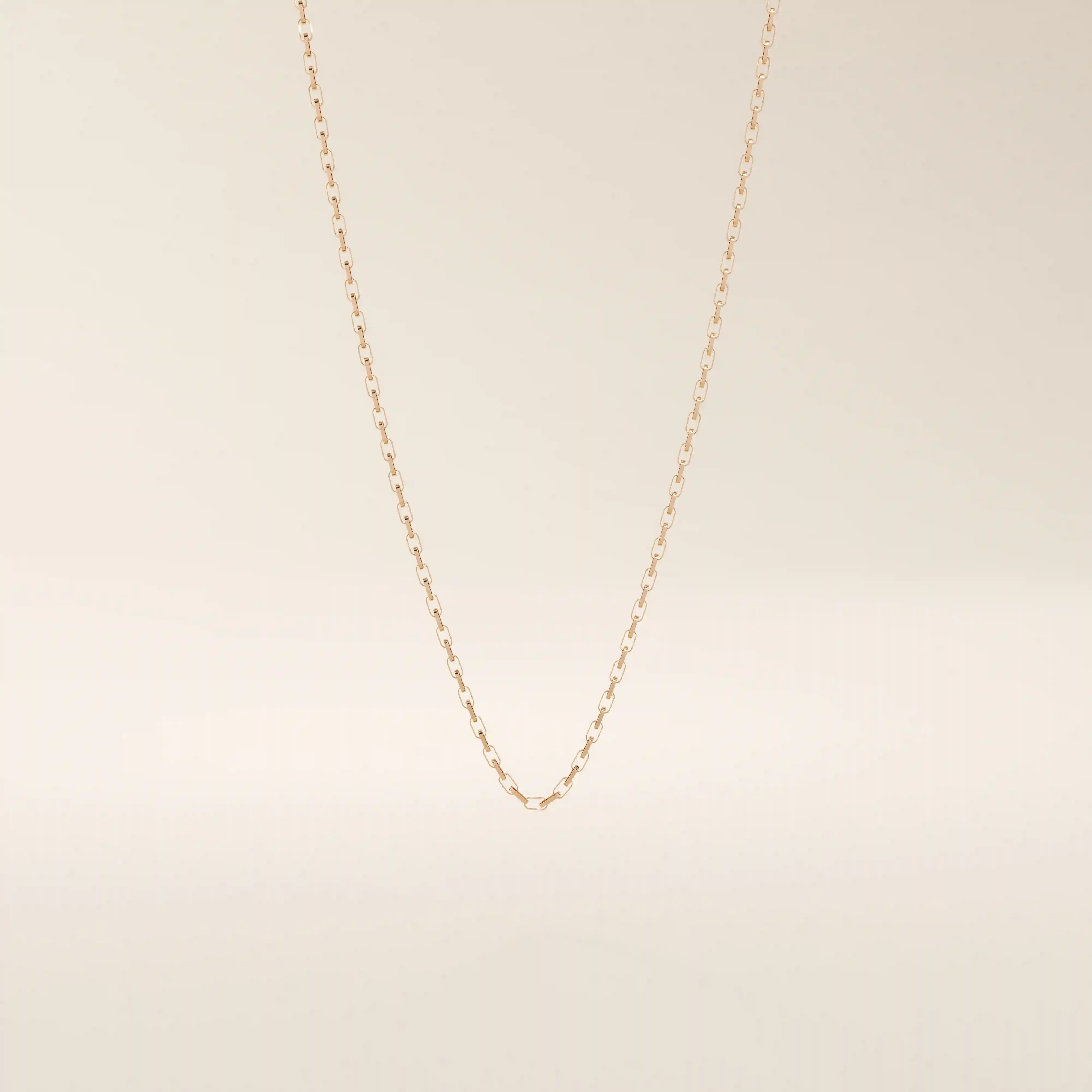14k solid gold rolo chain necklace with round interlocking links and polished shine. A classic and sturdy gold chain. Great for everyday wear or stacking.