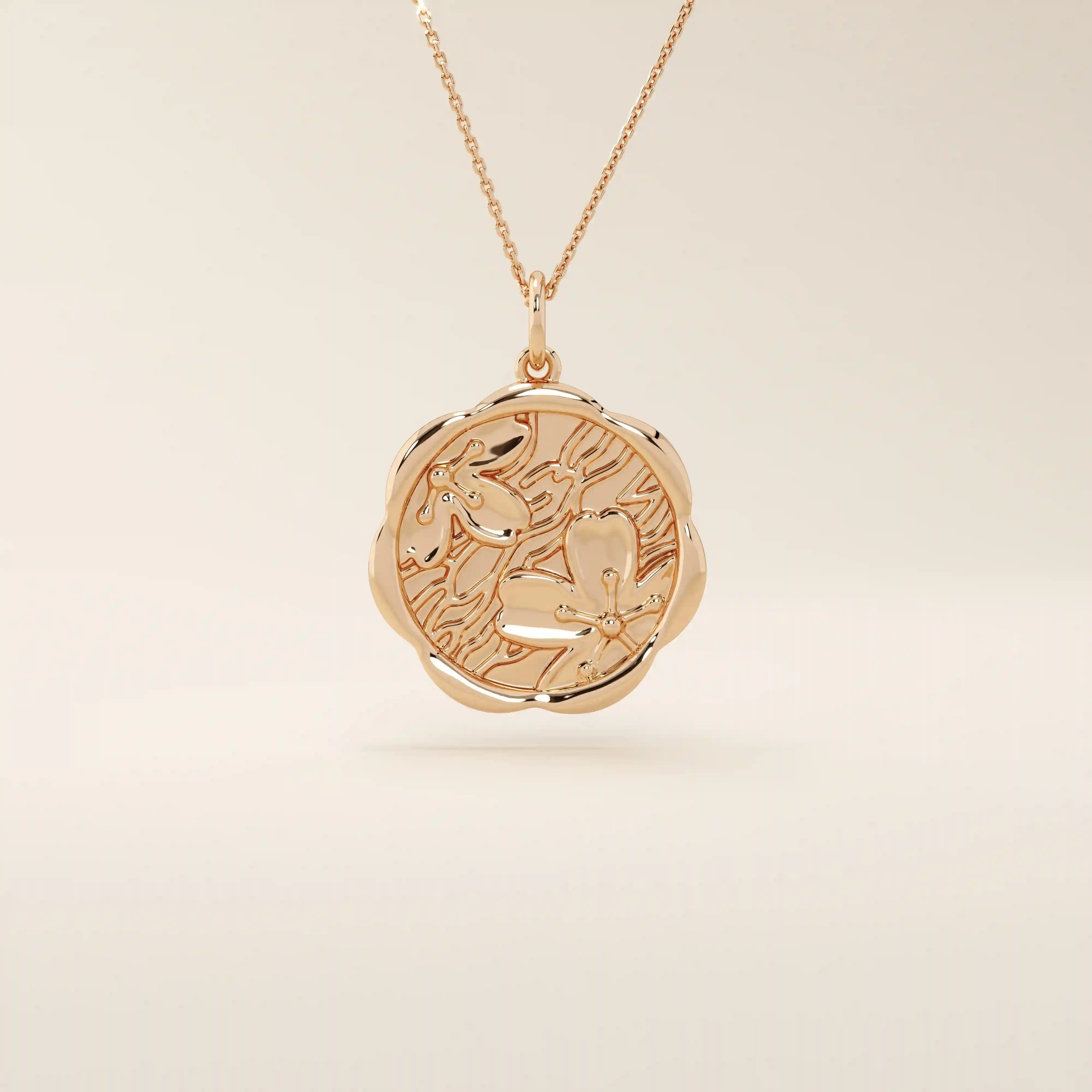 14k solid gold round pendant necklace with an embossed Sakura flower design. Delicate and nature-inspired gold jewelry. Ideal for daily minimalist style.