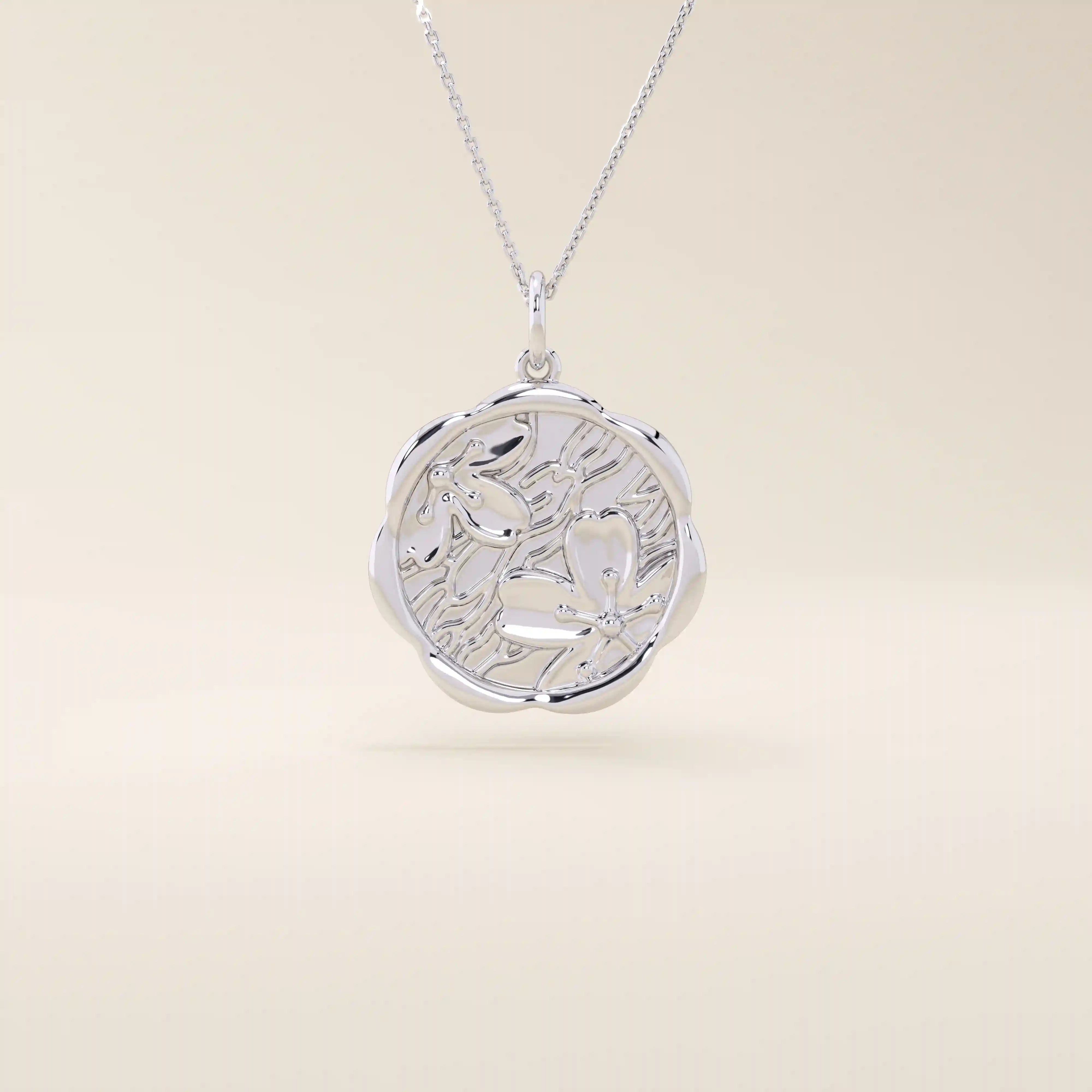 14k solid gold round pendant necklace with an embossed Sakura flower design. Delicate and nature-inspired gold jewelry. Ideal for daily minimalist style.