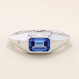 14k solid gold signet ring with a bezel set deep blue sapphire gemstone. A classic silhouette with a bold, modern twist. Ideal as a pinky ring or statement piece.