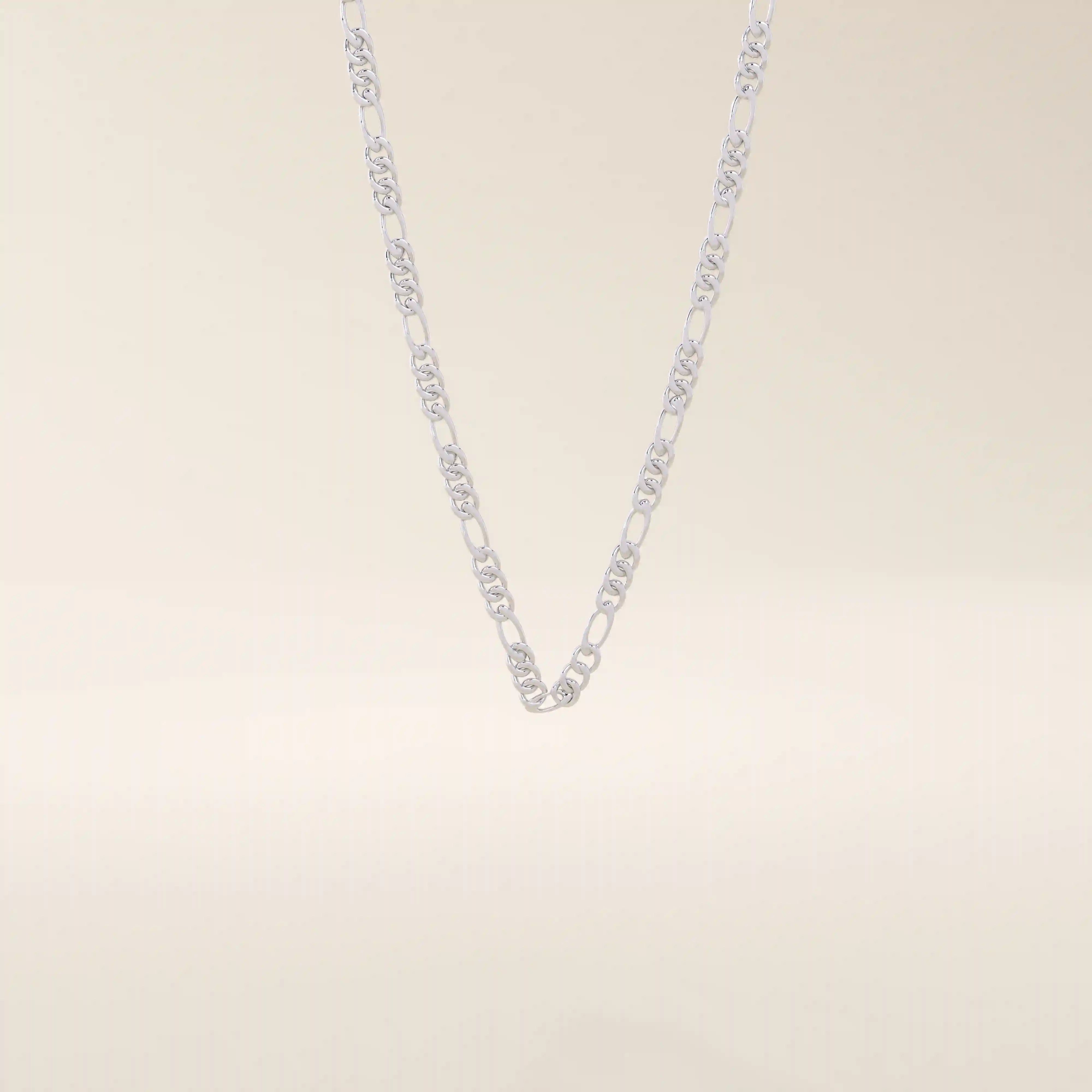 14k solid gold slim Figaro chain necklace with alternating short and long links. A classic and lightweight gold chain. Perfect for layering or daily wear.
