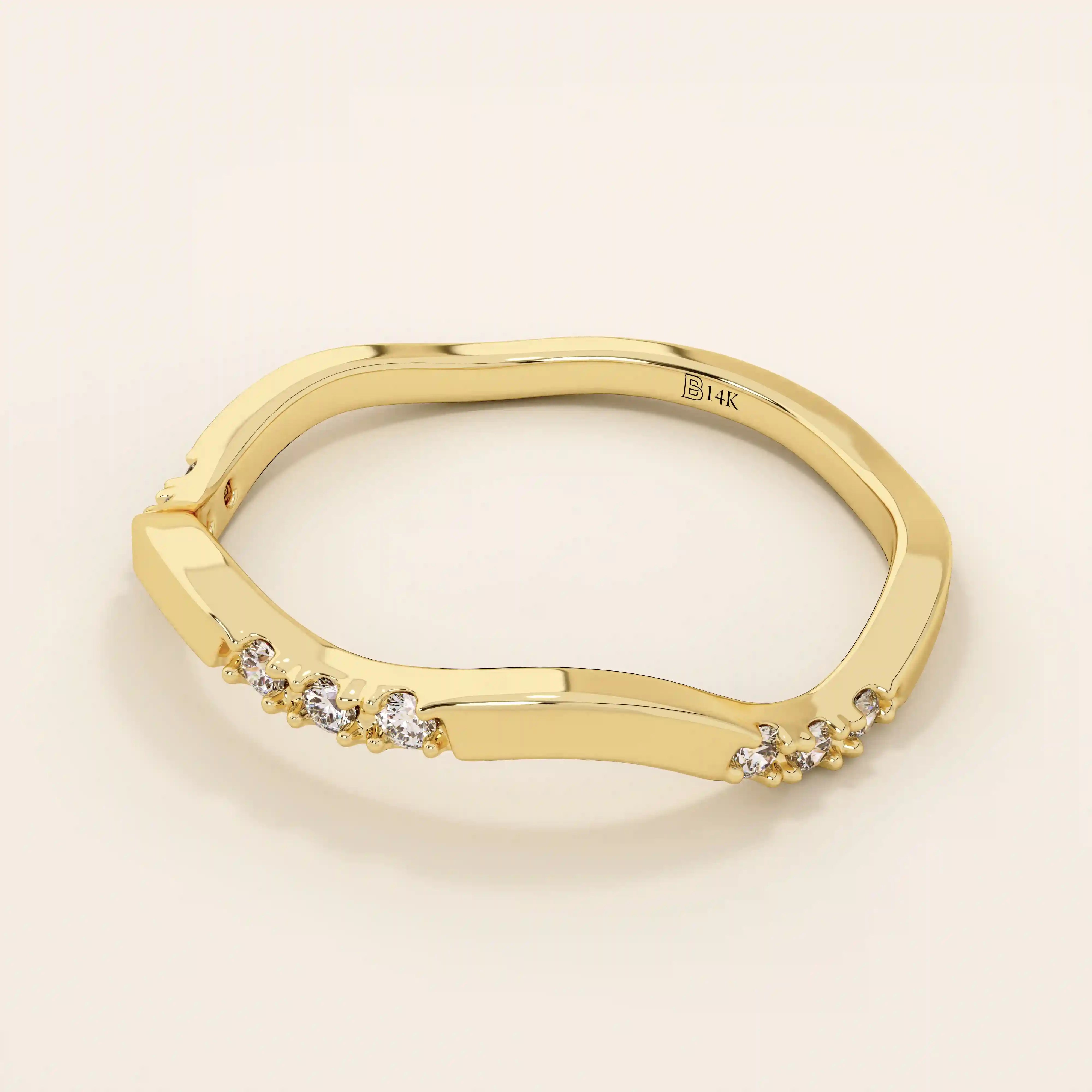 14k solid gold slim stacking ring with a delicate curvy band design and tiny moissanite accents. Minimalist and elegant for everyday wear.