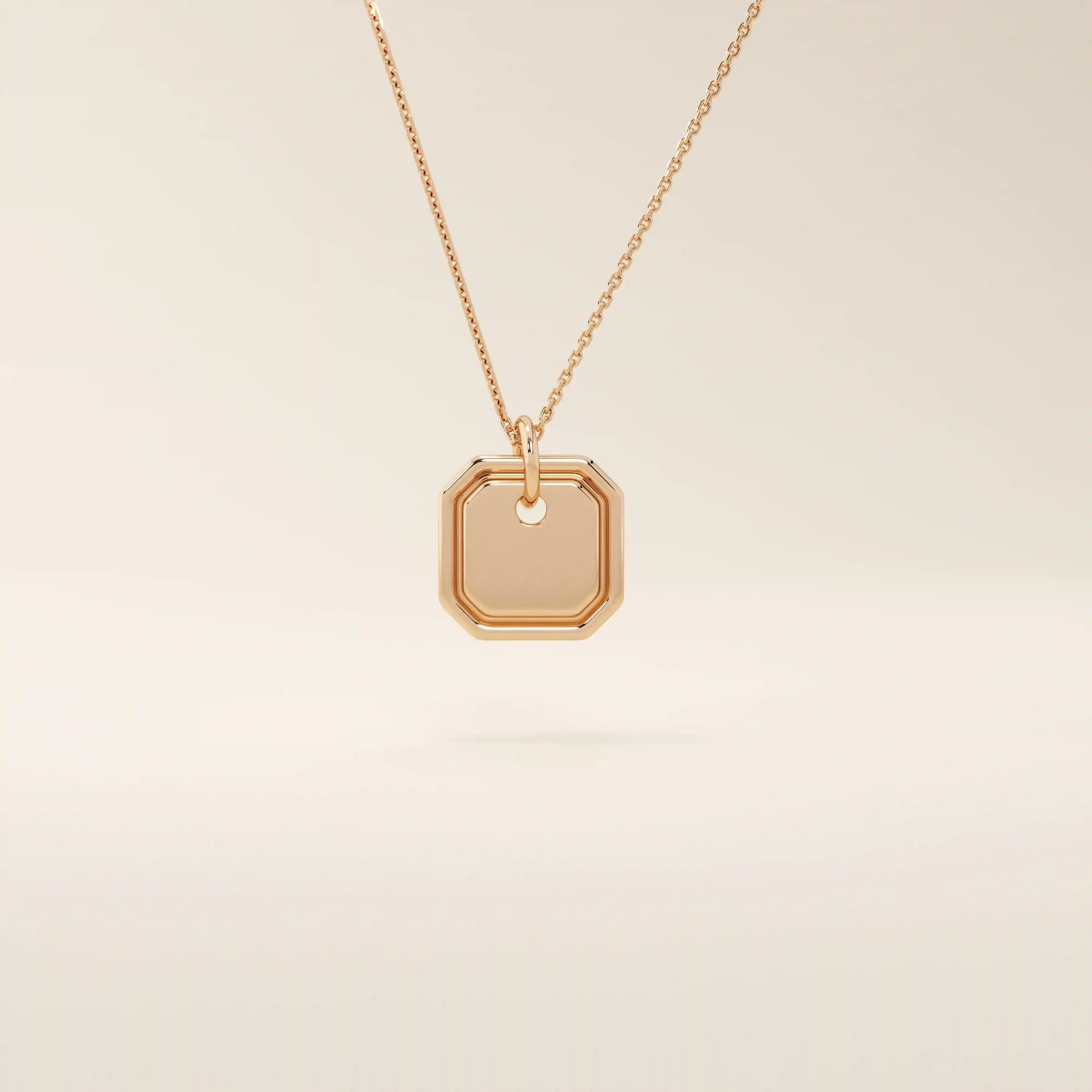 14k solid gold small octagon charm pendant with a minimalist shape and polished finish. A simple and timeless gold piece. Great for layering or everyday wear.