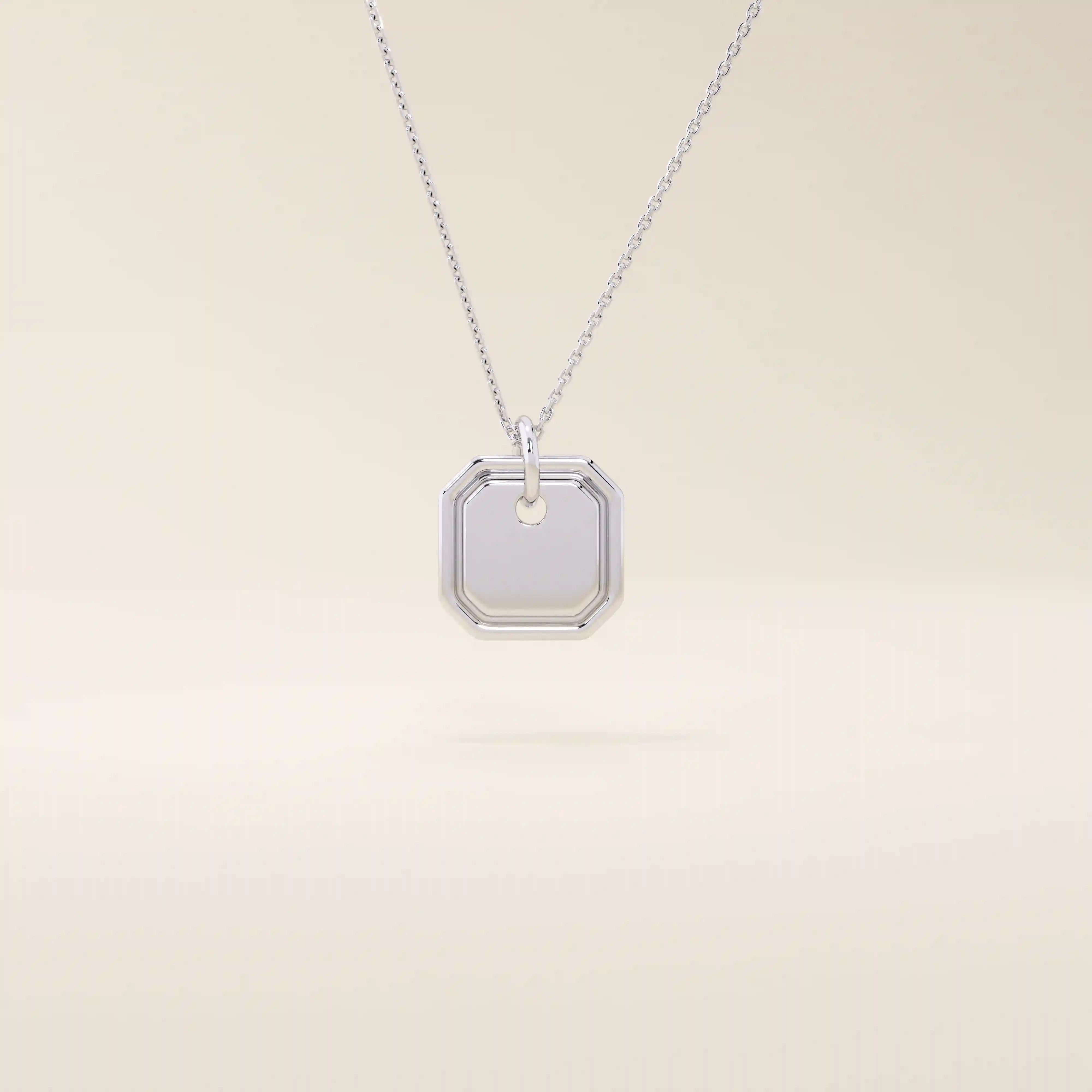 14k solid gold small octagon charm pendant with a minimalist shape and polished finish. A simple and timeless gold piece. Great for layering or everyday wear.