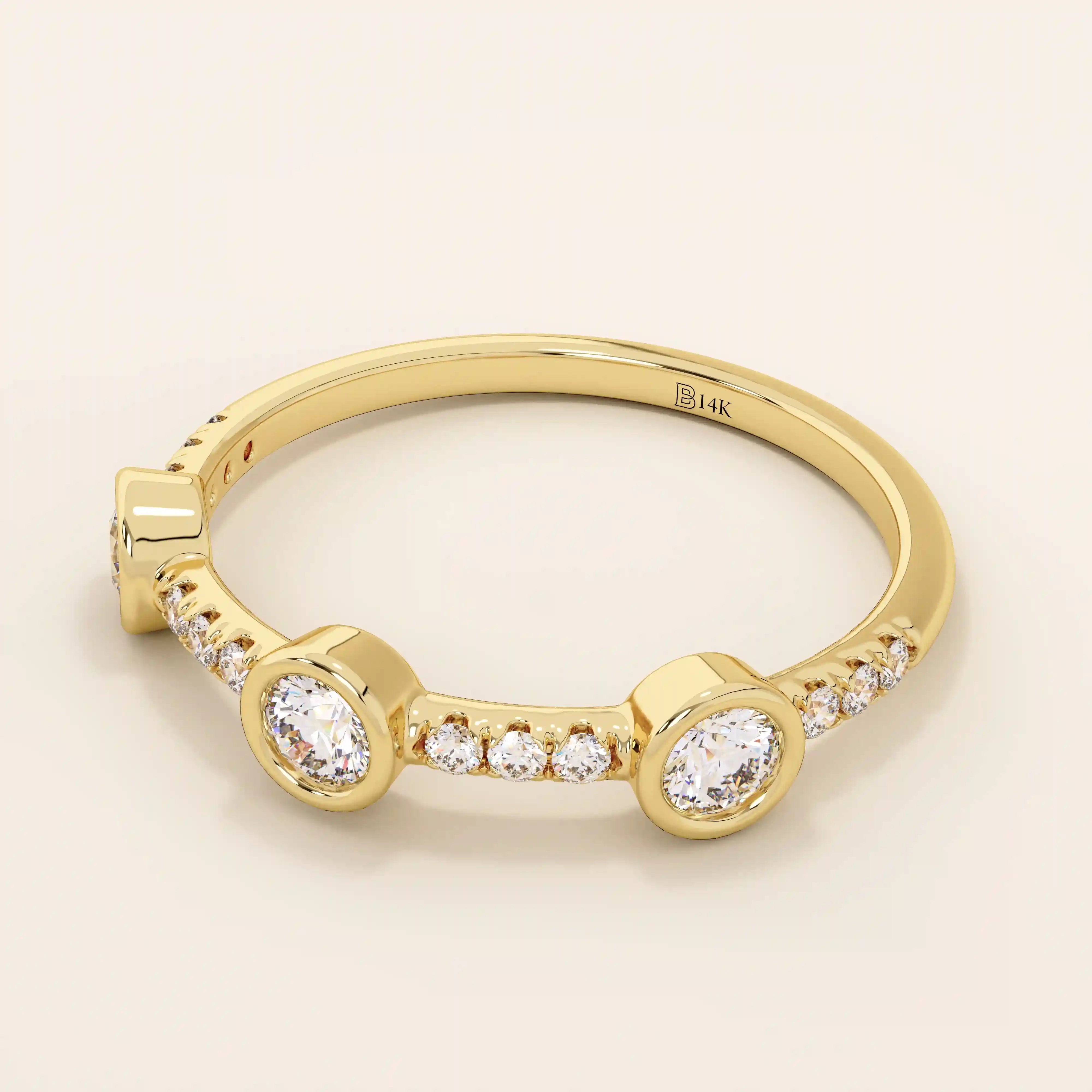 14k solid gold stacking ring featuring a half-eternity design with three bezel-set moissanites. Minimalist and versatile style.