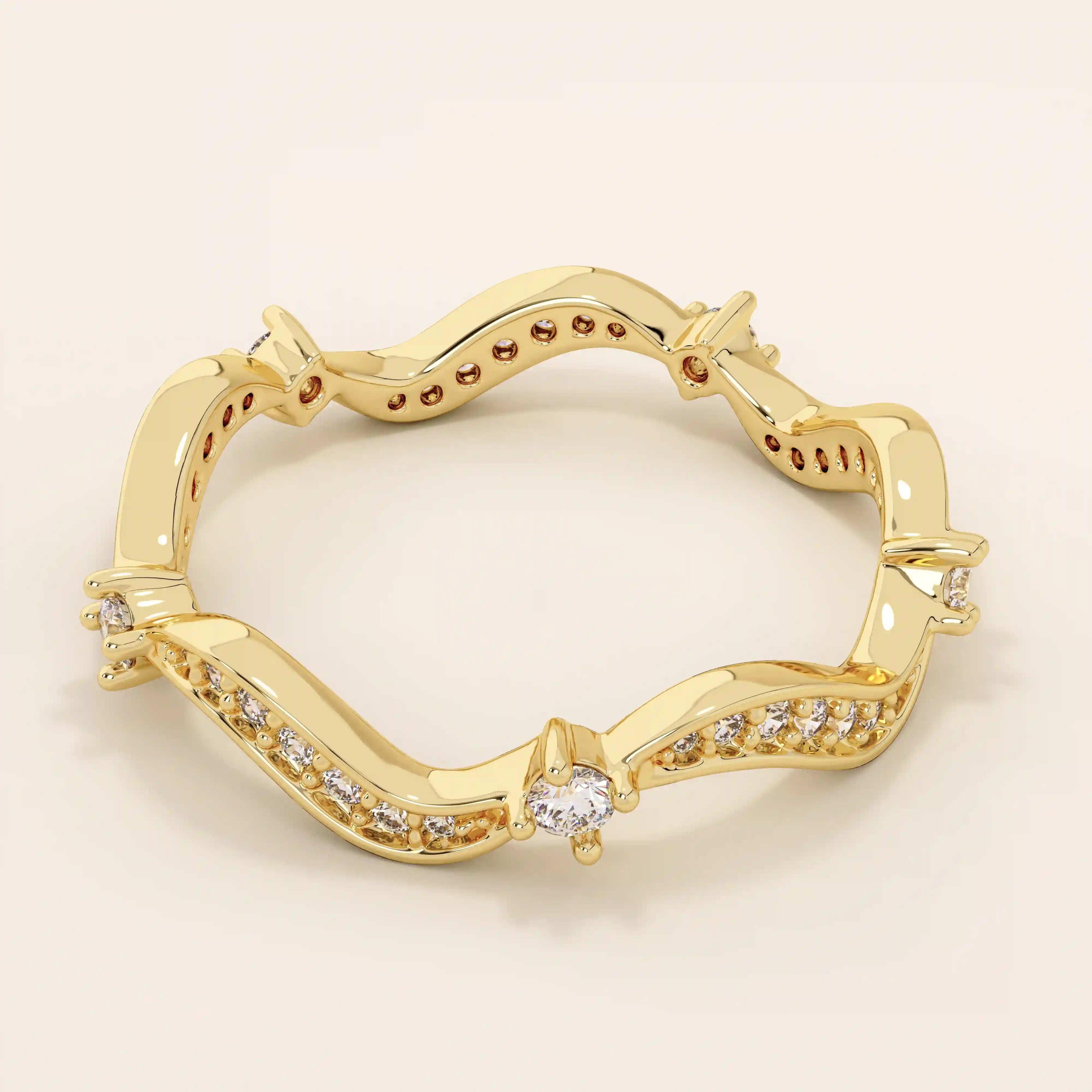 14k solid gold stacking ring featuring an ups and downs wave pattern. A modern and elegant band perfect for layering.