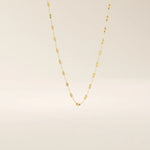 14k solid gold textured chain necklace with subtle shine and detailed finish. A classic gold chain with a unique touch. Great for everyday wear or layering.