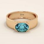 14k solid gold thick band ring with an oval cut topaz in a half bezel setting. Bold yet refined gemstone design. Perfect for stacking or solo wear.